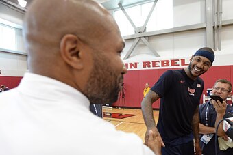 LAS VEGAS, NV - AUGUST 11:  Derek Fisher of the New York Knicks talks to Carmelo Anthony of the USA National Team during a minicamp at UNLV on August 11, 2015 in Las Vegas, Nevada. NOTE TO USER: User expressly acknowledges and agrees that, by downloading 