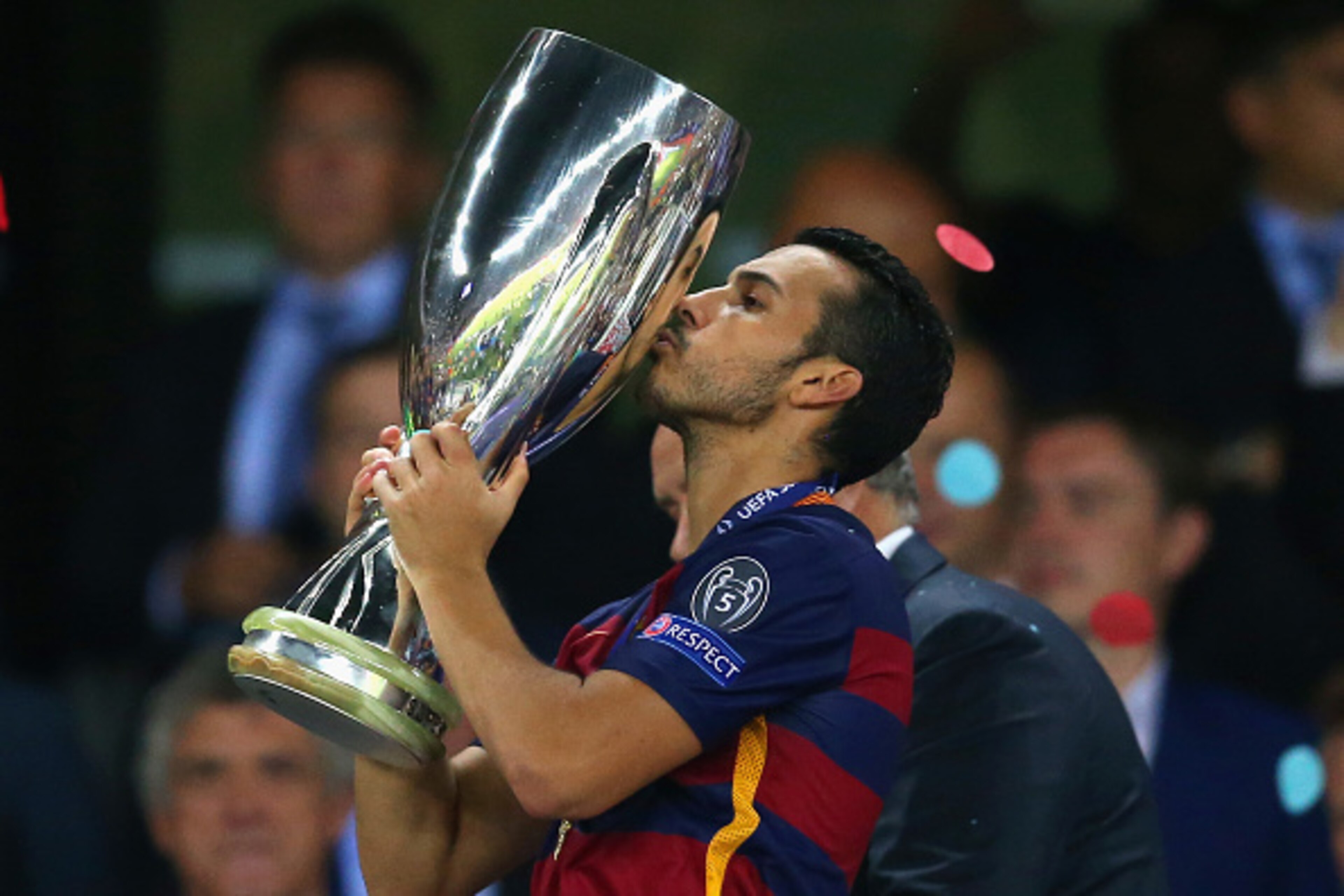 TBILISI, GEORGIA - AUGUST 11:  Pedro of Barcelona  kisses the UEFA Cup trophy as Barcelona celebrate victoy during the UEFA Super Cup between Barcelona and Sevilla FC at Dinamo Arena on August 11, 2015 in Tbilisi, Georgia.  (Photo by Chris Brunskill/Getty