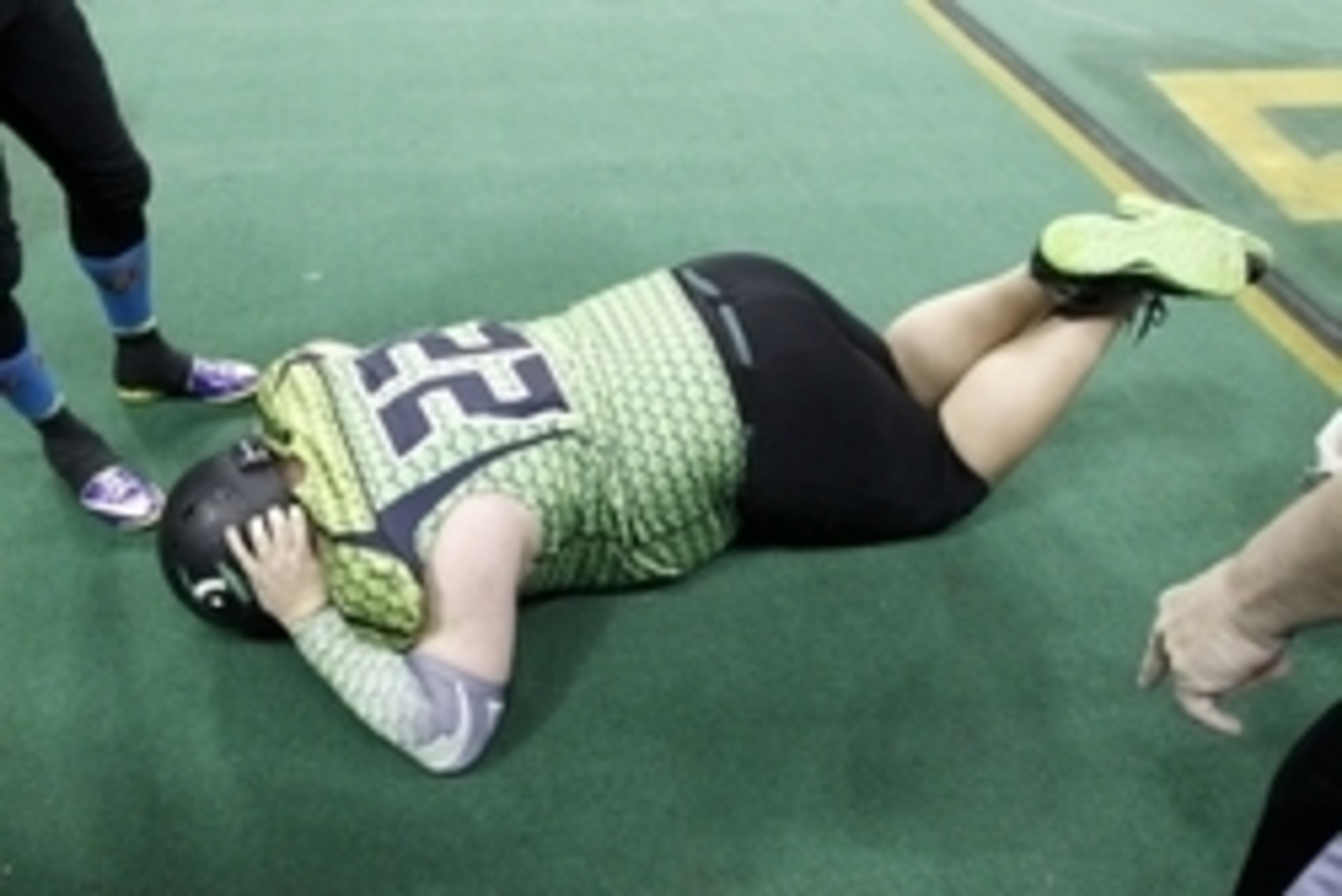 Feb 9, 2014; Highland Heights, KY, USA; Northern Kentucky River Monsters quarterback Jared Lorenzen lies on the turf injured during the second quarter at the Bank of Kentucky Center. Mandatory Credit: Frank Victores-USA TODAY Sports