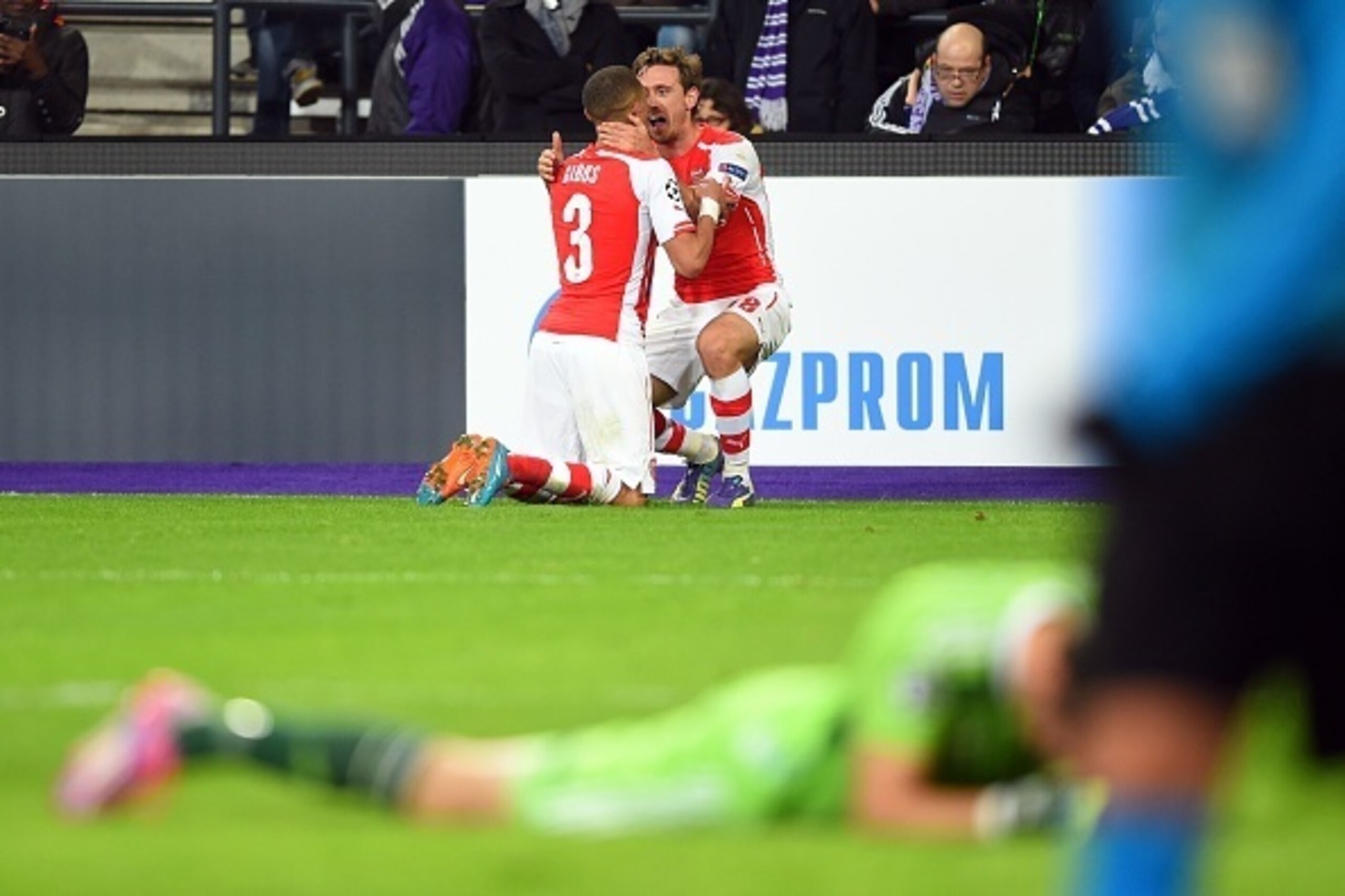 Arsenal's English defender Kieran Gibbs (C) celebrates with Arsenal's Spanish defender Nacho Monreal after scoring during a UEFA Champions League group stage football match Anderlecht vs Arsenal at the Constant Vanden Stock stadium in Anderlecht on Octobe