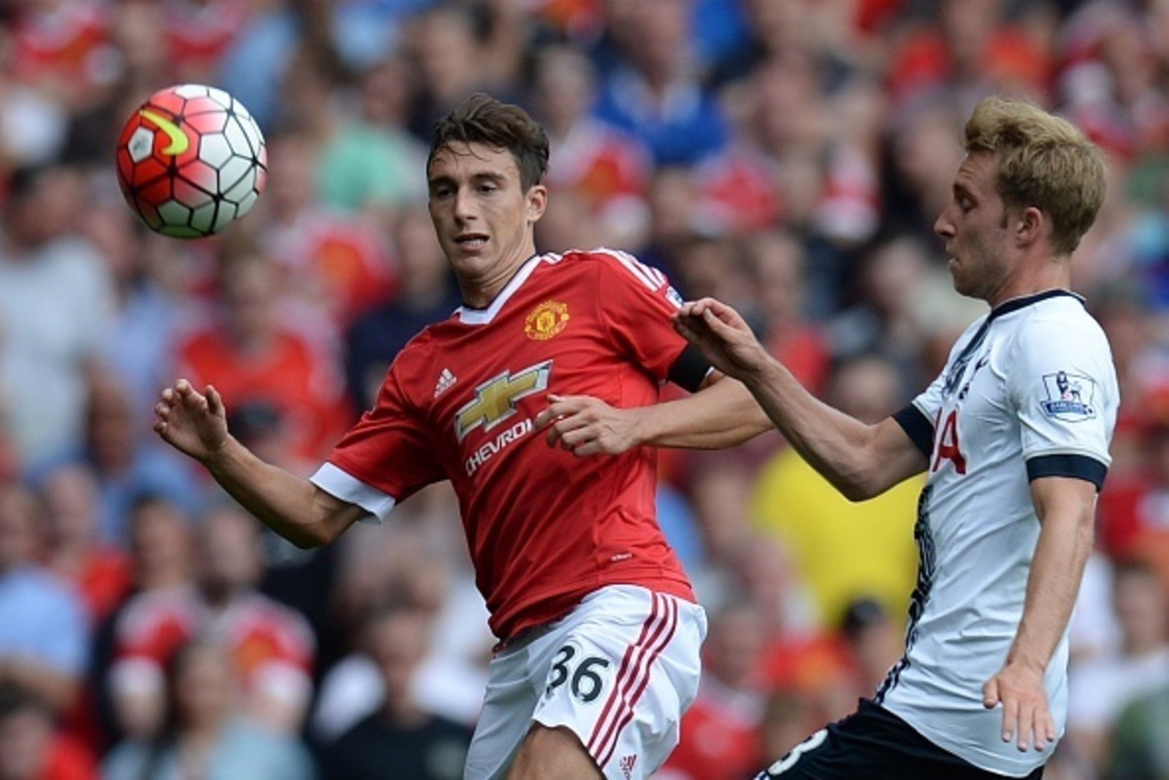 Manchester United's Italian defender Matteo Darmian (L) vies with Tottenham Hotspur's Danish midfielder Christian Eriksen during the English Premier League football match between Manchester United and Tottenham Hotspur at Old Trafford in Manchester, north