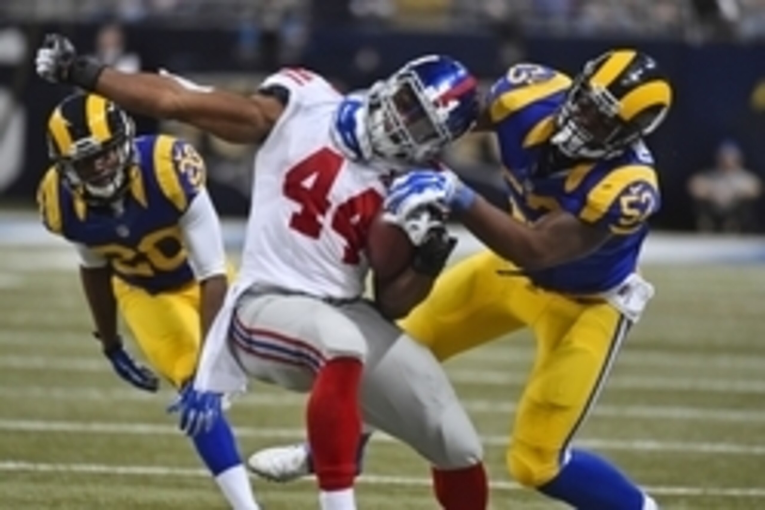 Dec 21, 2014; St. Louis, MO, USA; St. Louis Rams outside linebacker Alec Ogletree (52) bring down New York Giants running back Andre Williams (44) during the second half at the Edward Jones Dome. The New York Giants defeat the St. Louis Rams 37-27. Mandat