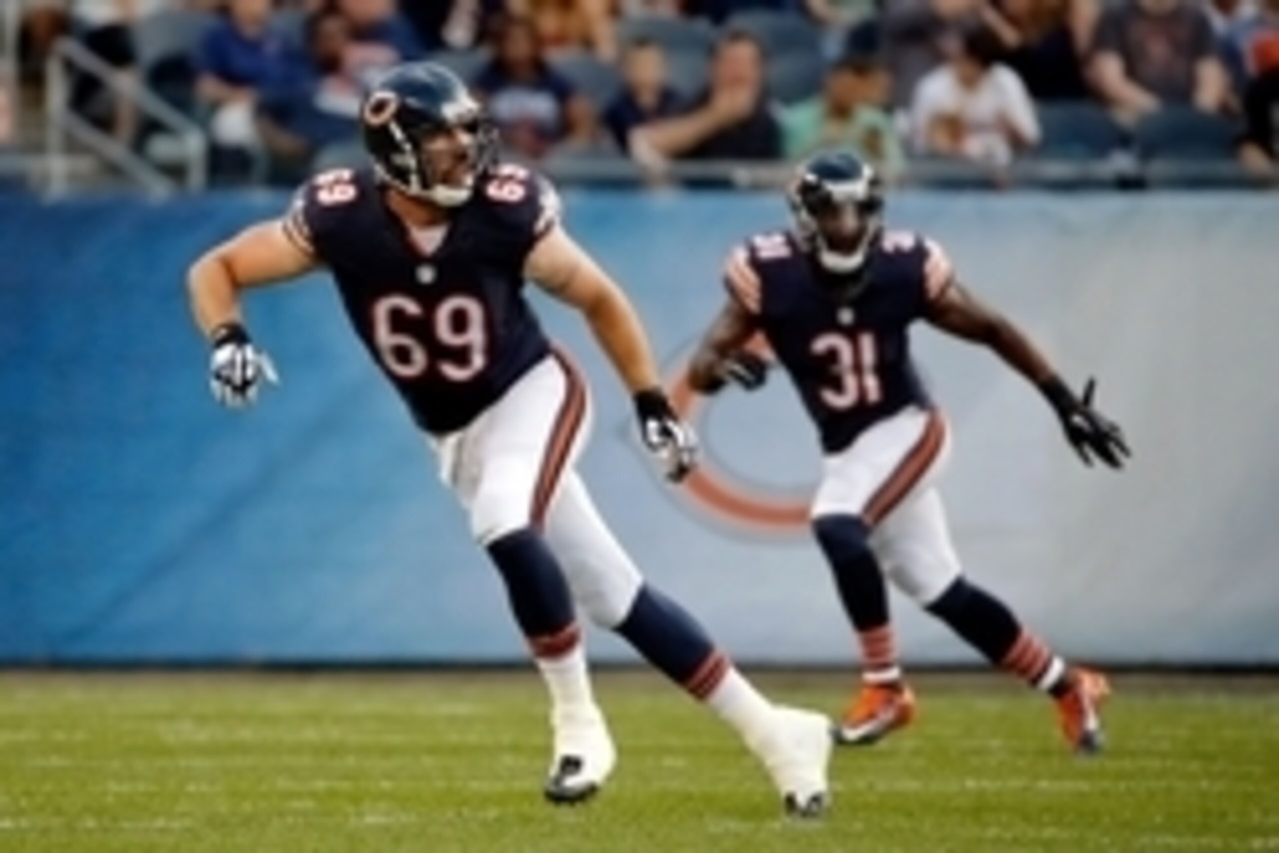 Aug 13, 2015; Chicago, IL, USA; Chicago Bears linebacker Jared Allen (69) and defensive back Antrel Rolle (31) follow the play during the first quarter against the Miami Dolphins in a preseason NFL football game at Soldier Field. Mandatory Credit: Jon Dur