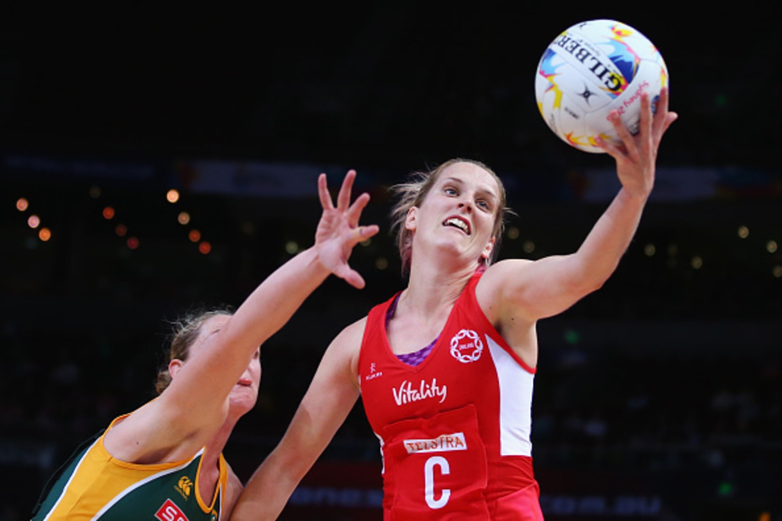 SYDNEY, AUSTRALIA - AUGUST 14:  Sara Bayman of England stretches to catch the ball during the 2015 Netball World Cup match between England and South Africa at Allphones Arena on August 14, 2015 in Sydney, Australia.  (Photo by Mark Kolbe/Getty Images)