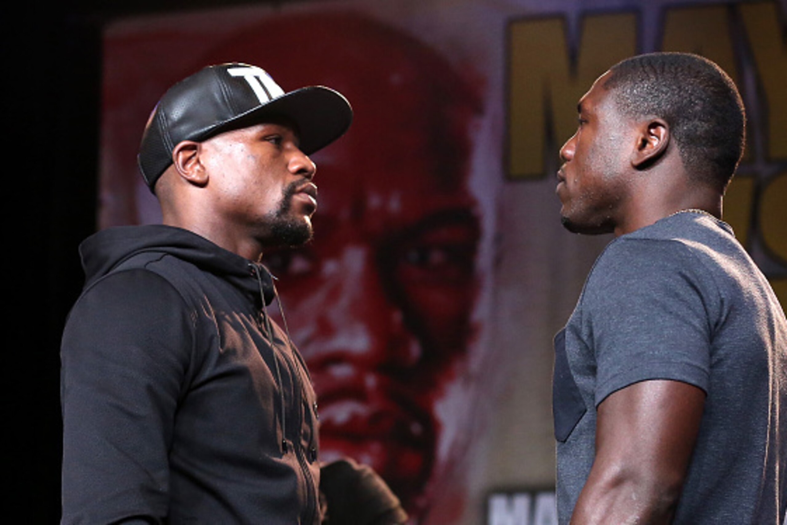 LOS ANGELES, CA - AUGUST 06:  Floyd Mayweather (L) and Andre Berto face off at a press conference ahead of the upcoming fight at JW Marriott Los Angeles at L.A. LIVE on August 6, 2015 in Los Angeles, California.  (Photo by Stephen Dunn/Getty Images)