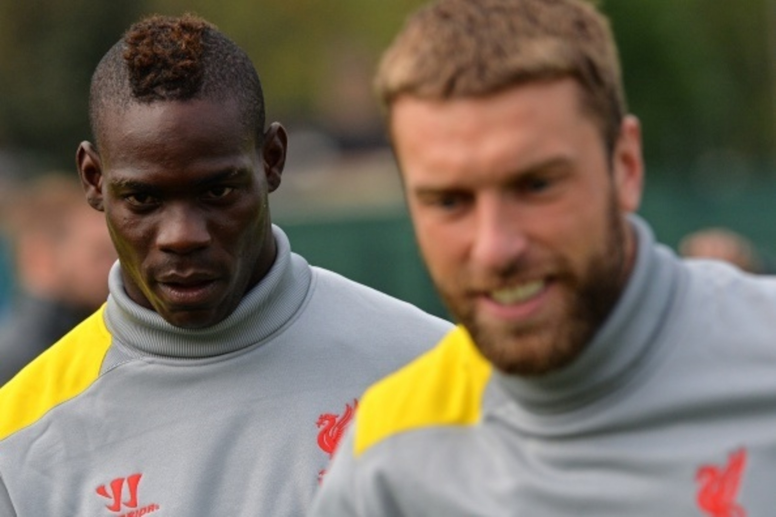 Liverpool's Italian forward Mario Balotelli (L) and Liverpool's English striker Rickie Lambert take part in a training session at their Melwood training ground in Liverpool, north-west England, on September 15, 2014, ahead of their UEFA Champions League m