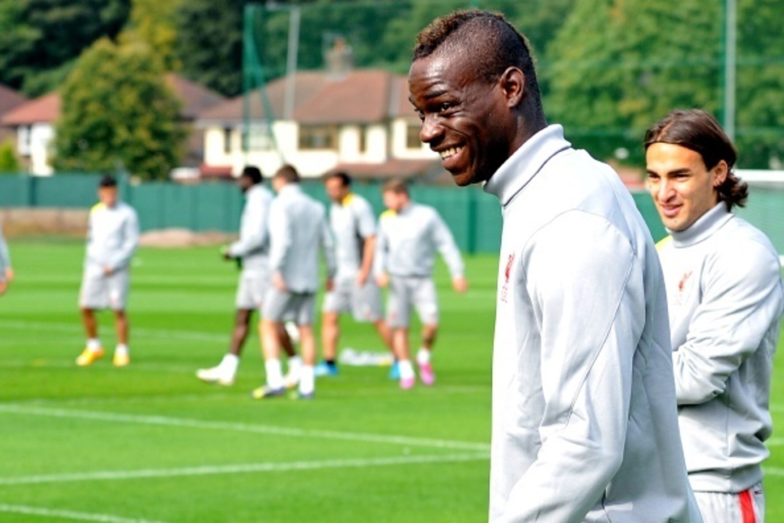 Liverpool's Italian forward Mario Balotelli (2nd R) takes part in a training session at their Melwood training ground in Liverpool, north-west England, on September 15, 2014, ahead of their UEFA Champions League match against Ludogorets at Anfield. AFP PH