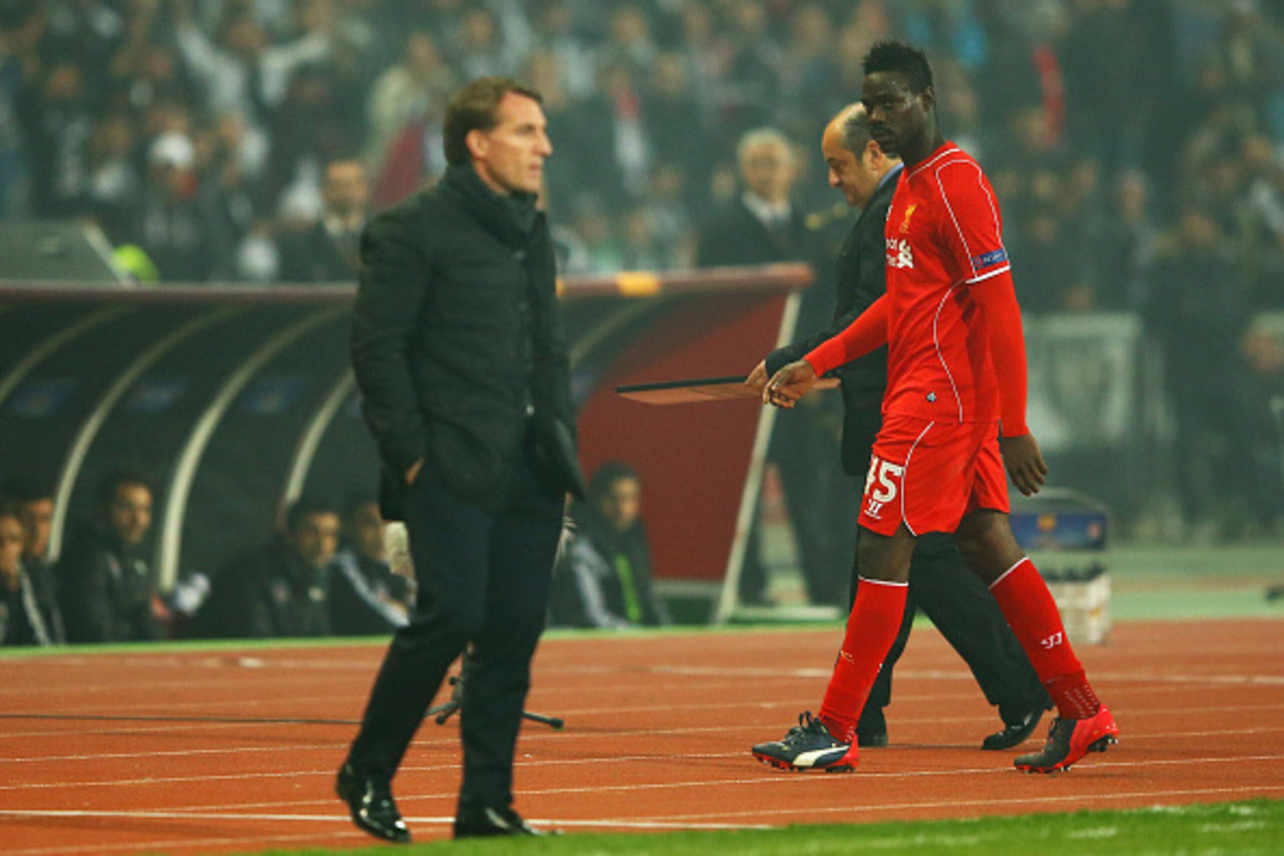 ISTANBUL, TURKEY - FEBRUARY 26:  Mario Balotelli of Liverpool looks across as Brendan Rodgers manager of Liverpool as he is substituted during the UEFA Europa League Round of 32 second leg match between Besiktas JK and Liverpool FC on February 26, 2015 in
