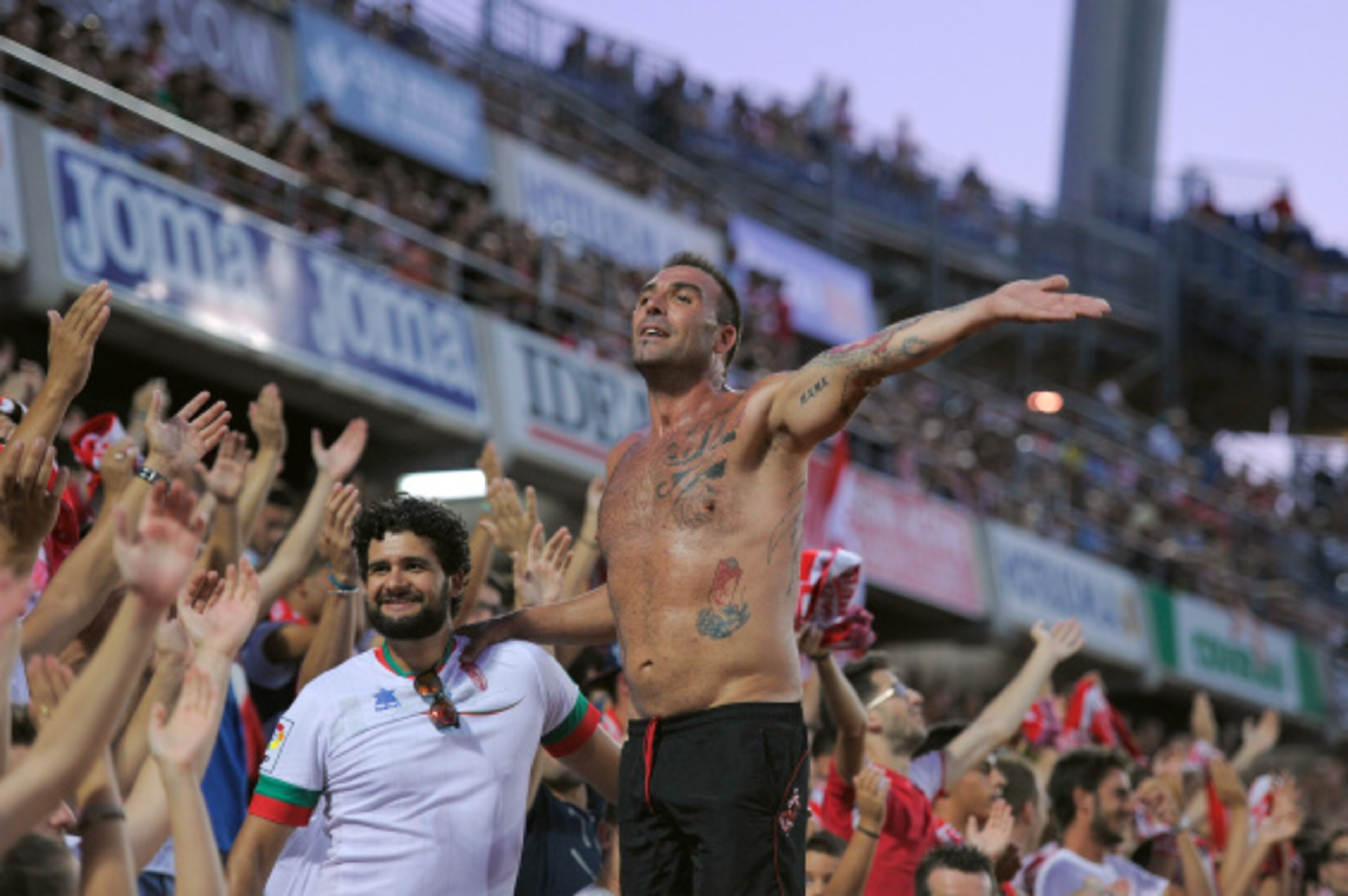 GRANADA, SPAIN - AUGUST 23:  A Granada CF fan cheers on his team during the La liga match between Granada CF and RC Deportivo La Coruna at Estadio Nuevo Los Carmenes on August 23, 2014 in Granada, Spain.  (Photo by Denis Doyle/Getty Images)