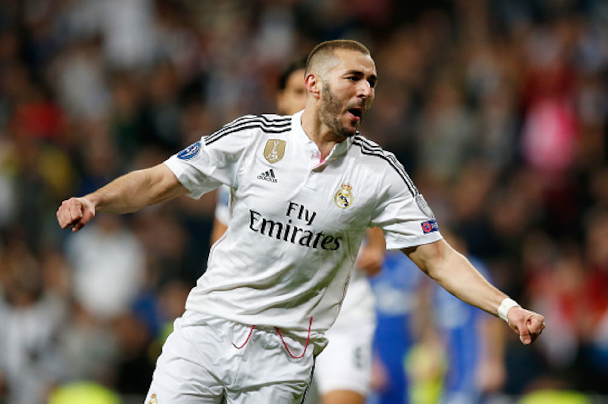 MADRID, SPAIN - MARCH 10:  Karim Benzema of Real Madrid celebrates after scoring his team's third goal during the UEFA Champions League Round of 16 second leg match between Real Madrid CF and FC Schalke 04 at Estadio Santiago Bernabeu on March 10, 2015 in