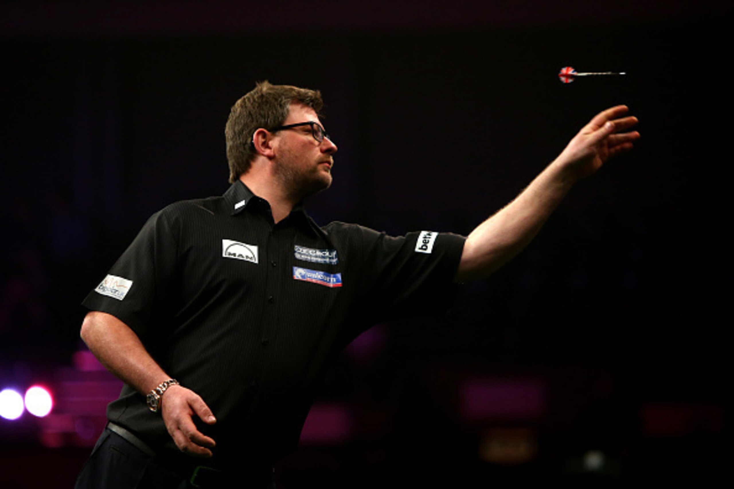 BRIGHTON, ENGLAND - MAY 14: James Wade of England in action during his match against Phil Taylor of England during the Betway Premier League at The Brighton Centre on May 14, 2015 in Brighton, England. (Photo by Charlie Crowhurst/Getty Images)