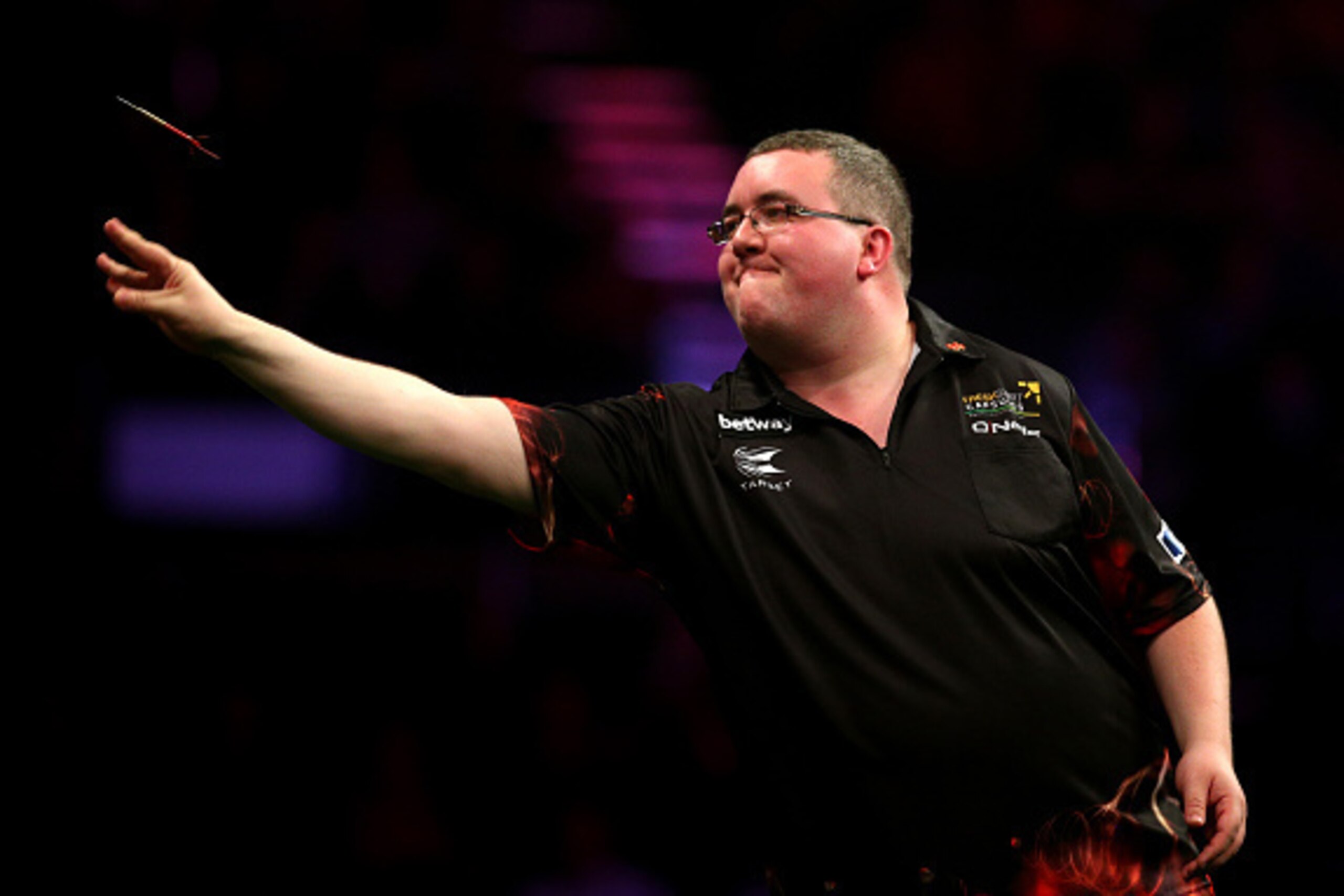 BRIGHTON, ENGLAND - MAY 14: Stephen Bunting of England in action during his match against Raymond van Barneveld of Holland during the Betway Premier League at The Brighton Centre on May 14, 2015 in Brighton, England. (Photo by Charlie Crowhurst/Getty Imag