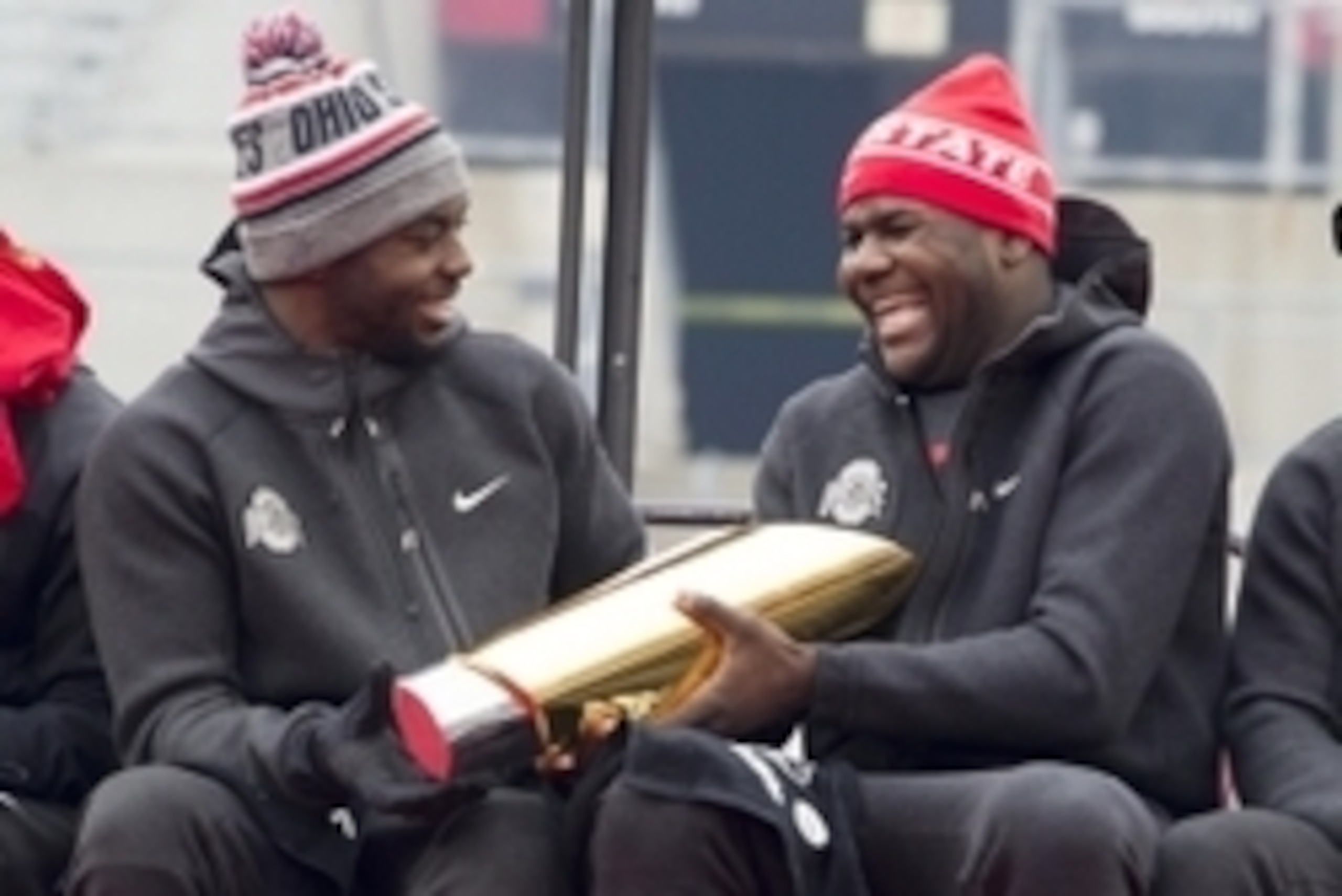 Jan 24, 2015; Columbus, OH, USA; Ohio State Buckeyes quarterback J.T. Barrett (16) hands the National Championship trophy to quarterback Cardale Jones (12) during the National Championship celebration at Ohio Stadium. Mandatory Credit: Greg Bartram-USA TO