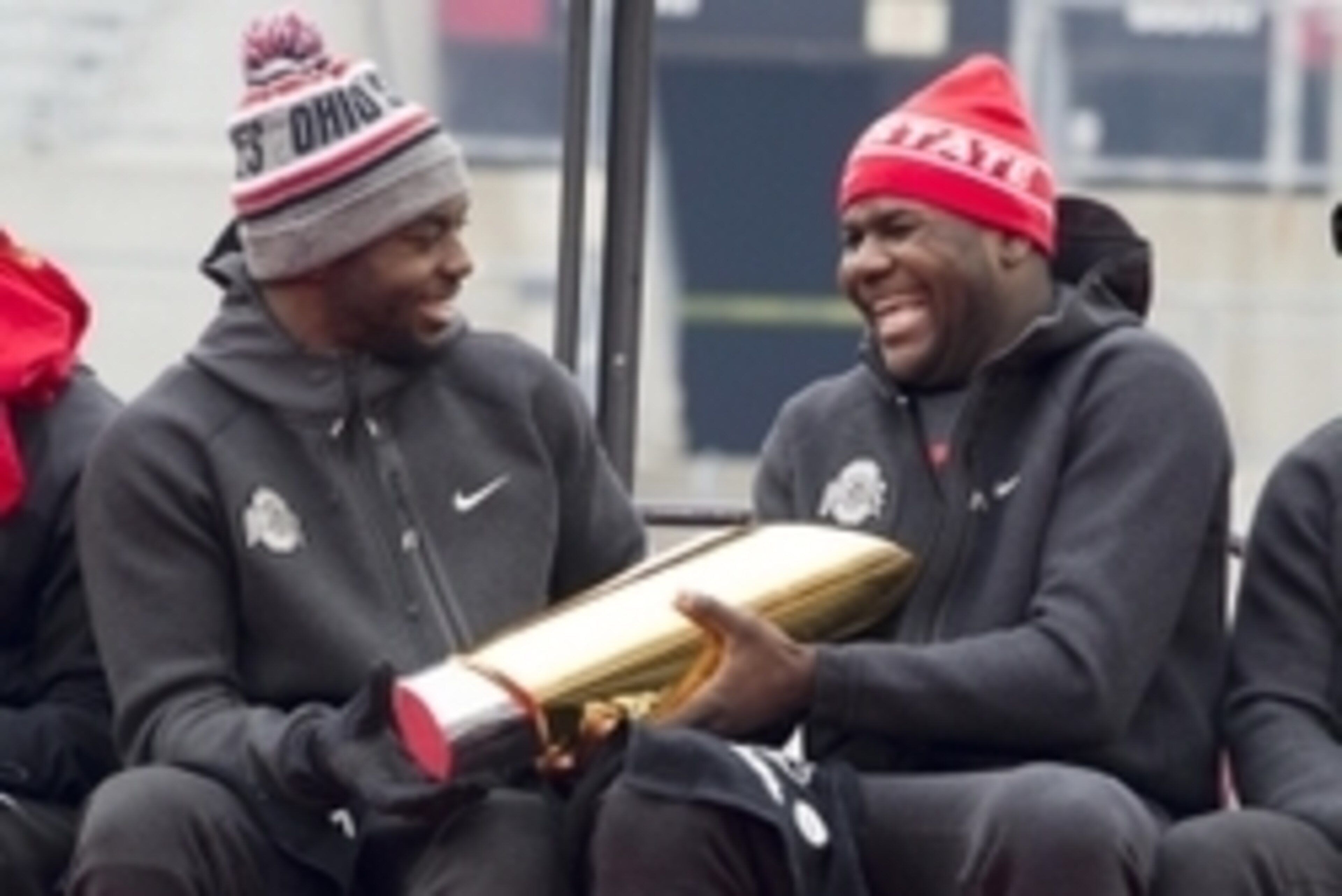 Jan 24, 2015; Columbus, OH, USA; Ohio State Buckeyes quarterback J.T. Barrett (16) hands the National Championship trophy to quarterback Cardale Jones (12) during the National Championship celebration at Ohio Stadium. Mandatory Credit: Greg Bartram-USA TO