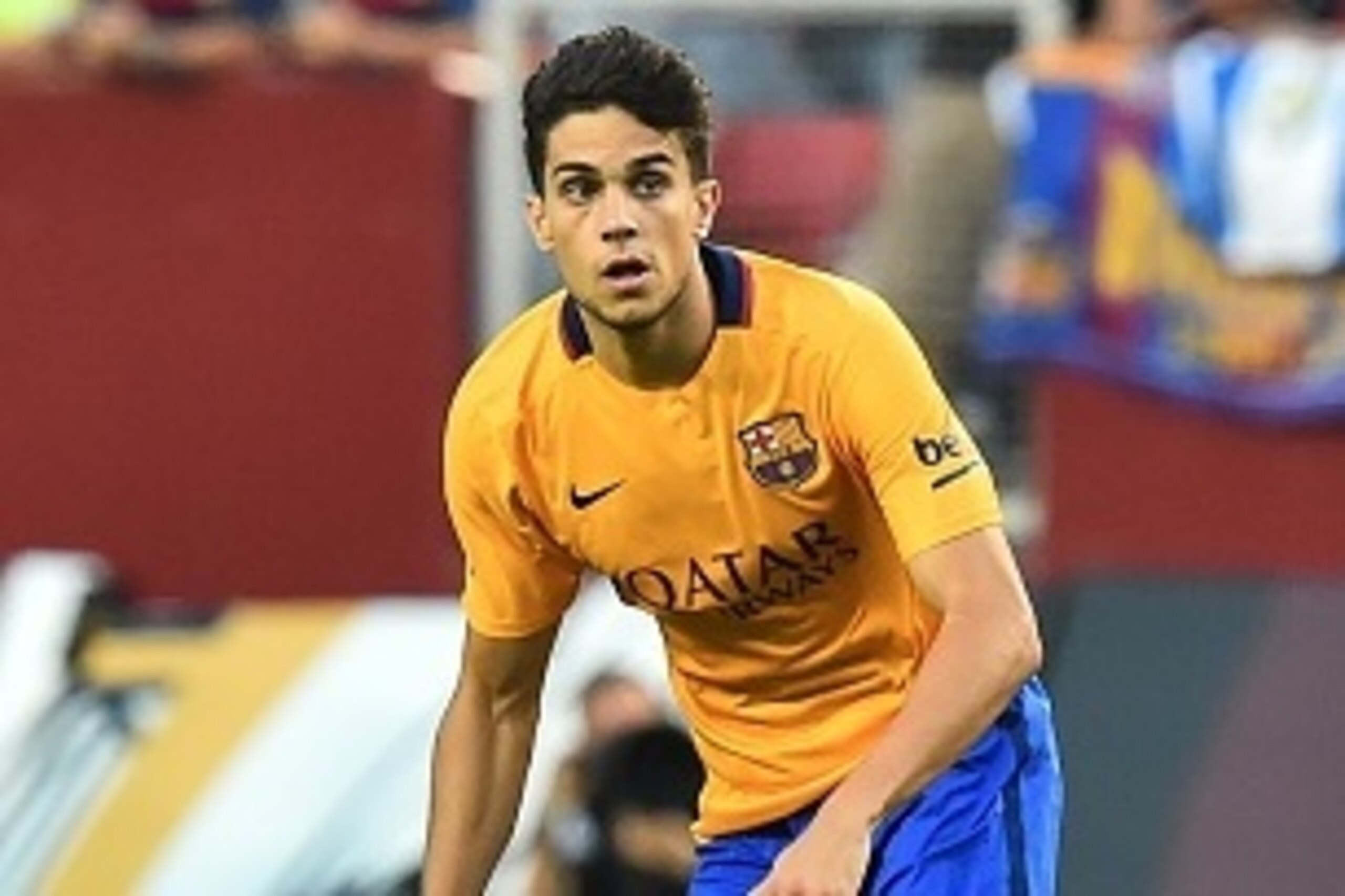 Barcelona's Marc Bartra looks to pass the ball during an International Champions Cup football match against Chelsea in Landover, Maryland, on July 28, 2015.    AFP PHOTO/NICHOLAS KAMM        (Photo credit should read NICHOLAS KAMM/AFP/Getty Images)