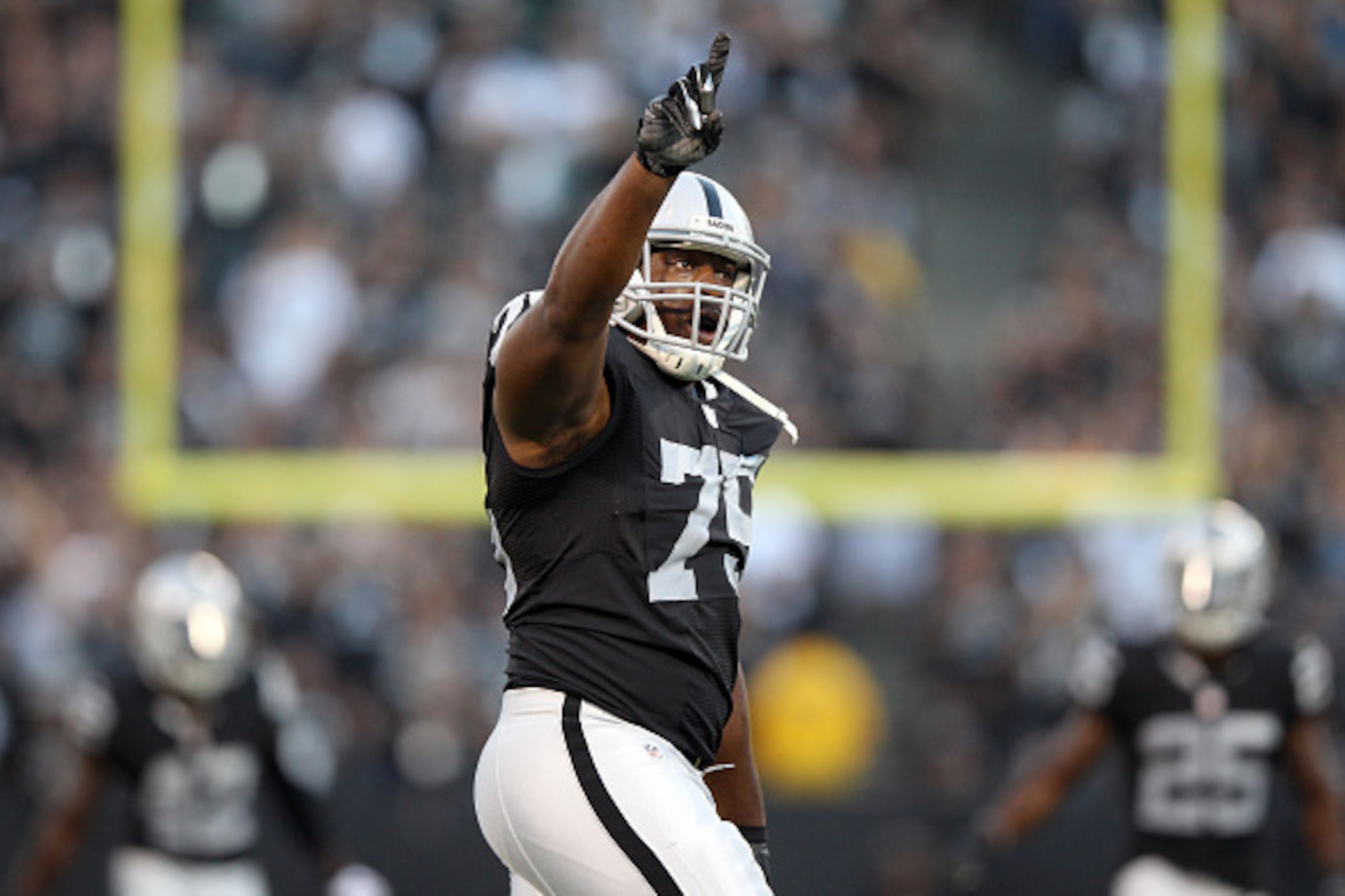 OAKLAND, CA - AUGUST 14:  Shelby Harris #75 of the Oakland Raiders celebrates after to sacked Nick Foles #5 of the St. Louis Rams at O.co Coliseum on August 14, 2015 in Oakland, California.  (Photo by Ezra Shaw/Getty Images)