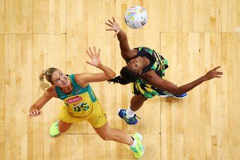SYDNEY, AUSTRALIA - AUGUST 15:  Caitlin Bassett of the Diamonds competes with Stacian Facey of Jamaica during the 2015 Netball World Cup Semi Final 2 match between Australia and Jamaica at Allphones Arena on August 15, 2015 in Sydney, Australia.  (Photo b