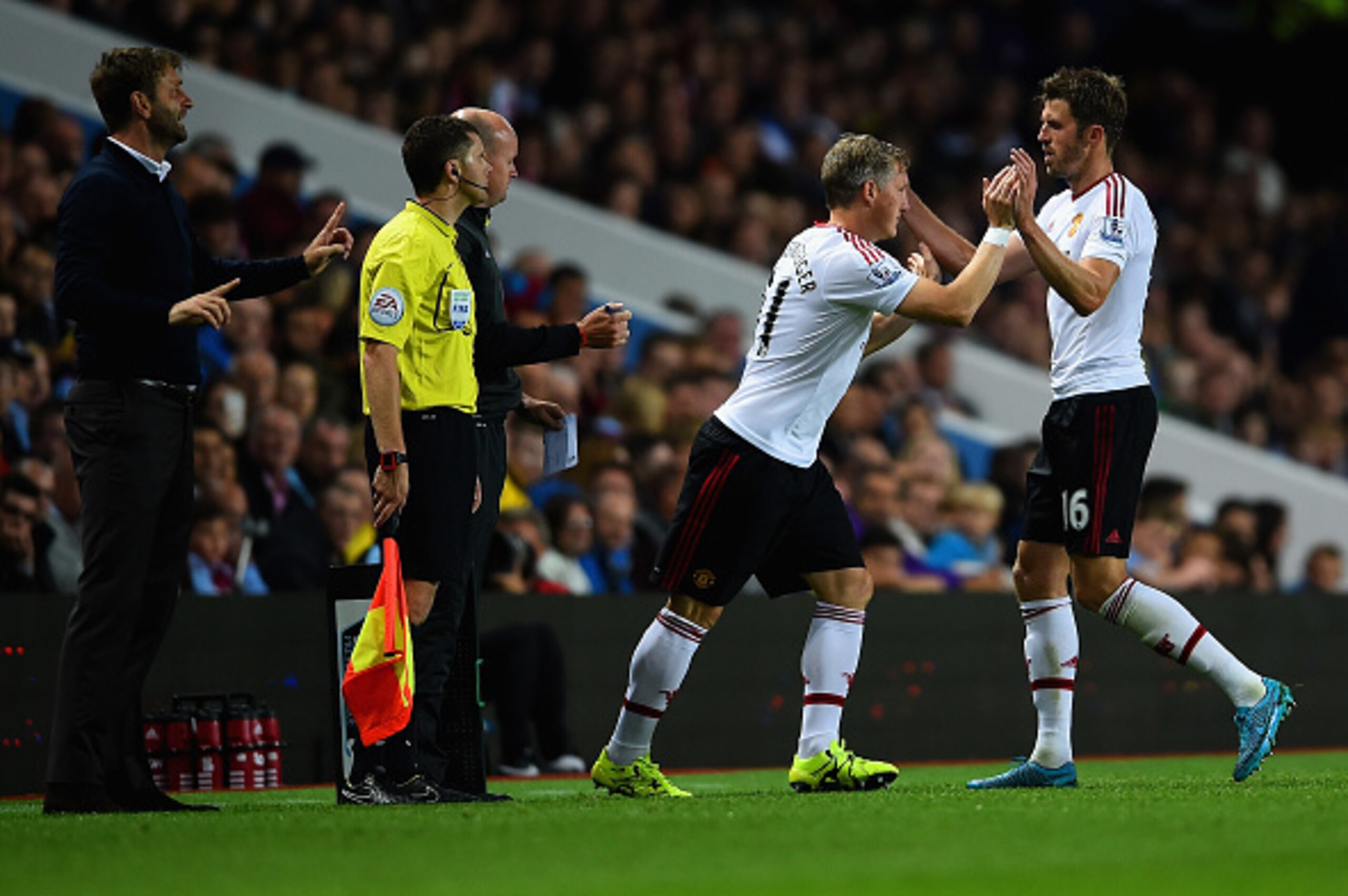 BIRMINGHAM, ENGLAND - AUGUST 14:  Bastian Schweinsteiger of Manchester United replaces Michael Carrick of Manchester United during the Barclays Premier League match between Aston Villa and Manchester United on August 14, 2015 in Birmingham, United Kingdom