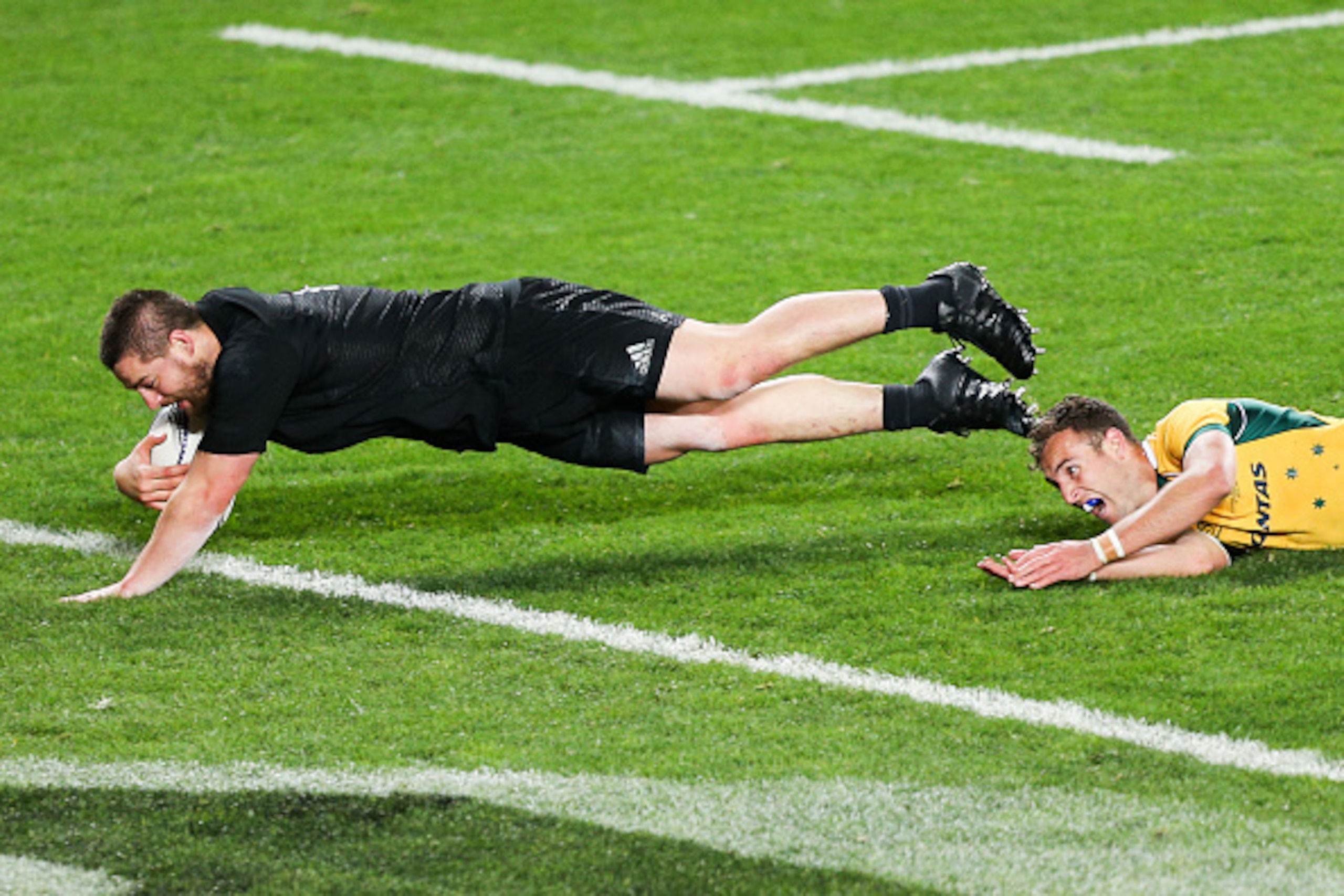 AUCKLAND, NEW ZEALAND - AUGUST 15:  Dane Coles of the All Blacks beats the tackle of Nic White of the Wallabies to score a try during The Rugby Championship, Bledisloe Cup match between the New Zealand All Blacks and the Australian Wallabies at Eden Park 