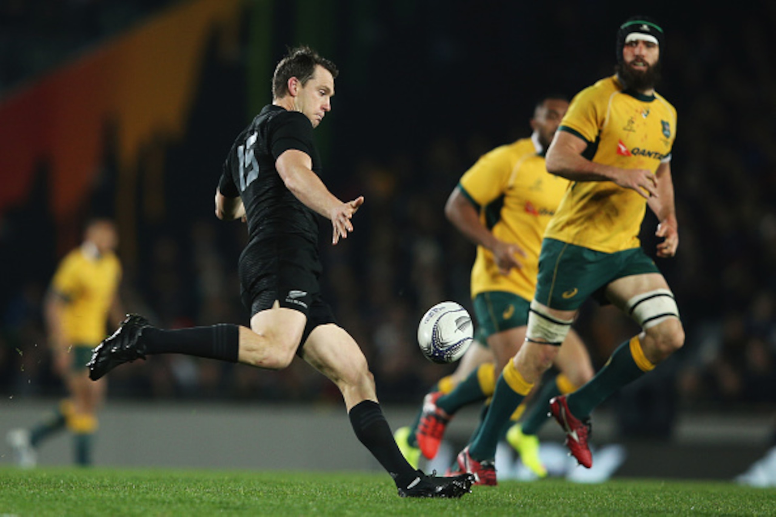 AUCKLAND, NEW ZEALAND - AUGUST 15: Ben Smith of the New Zealand All Blacks kicks the ball through during The Rugby Championship, Bledisloe Cup match between the New Zealand All Blacks and the Australian Wallabies at Eden Park on August 15, 2015 in Aucklan