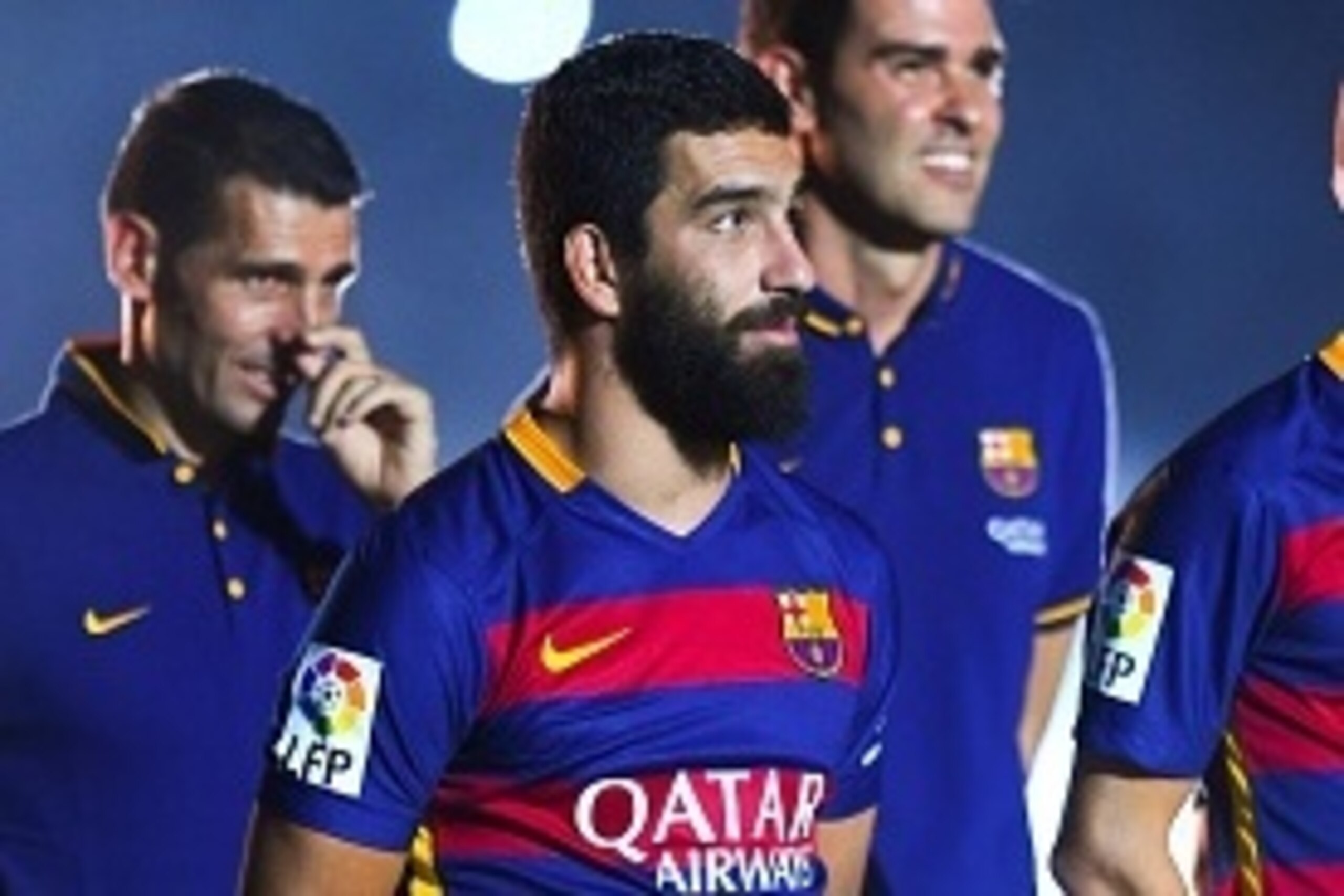 BARCELONA, SPAIN - AUGUST 05:  Arda Turan (L) and Aleix Vidal of FC Barcelona look on during the team official presentation ahead of the Joan Gamper trophy match at Camp Nou on August 5, 2015 in Barcelona, Spain.  (Photo by David Ramos/Getty Images)