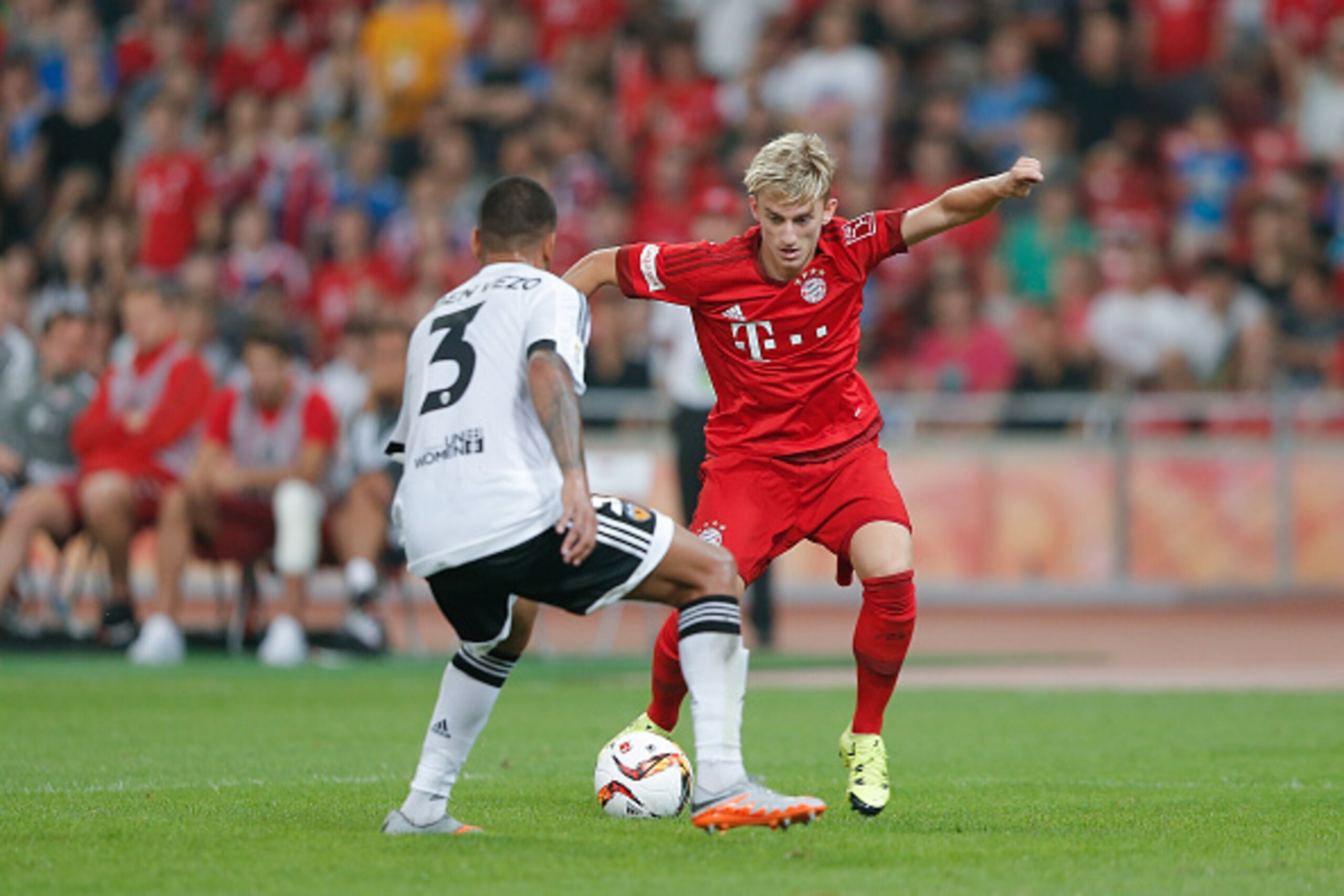 BEIJING, CHINA - JULY 18:  Sinan Kurt (R) of FC Bayern Muenchen challenges with Ruben Nunes Vezo of Valencia FC during the international friendly match between FC Bayern Muenchen and Valencia FC during the Audi Football Summit Beijing 2015 at National Sta