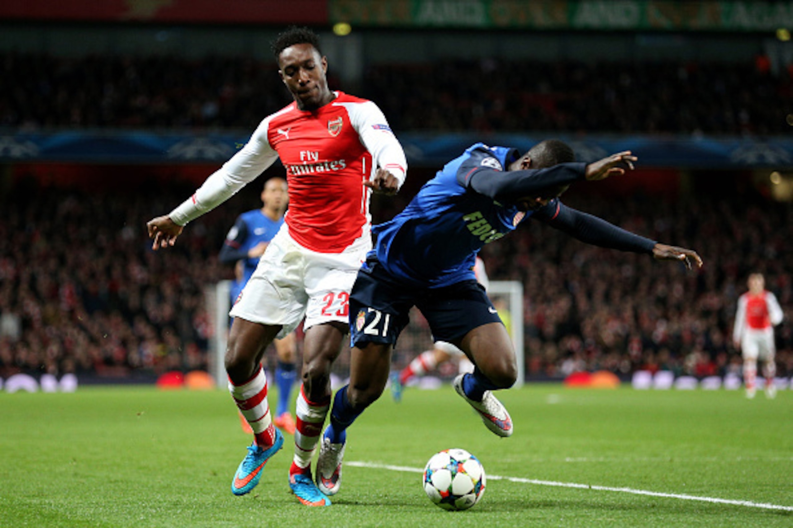 LONDON, ENGLAND - FEBRUARY 25:  Danny Welbeck of Arsenal and Elderson Uwa Echiejile of Monaco compete for the ball during the UEFA Champions League round of 16, first leg match between Arsenal and Monaco at The Emirates Stadium on February 25, 2015 in Lon