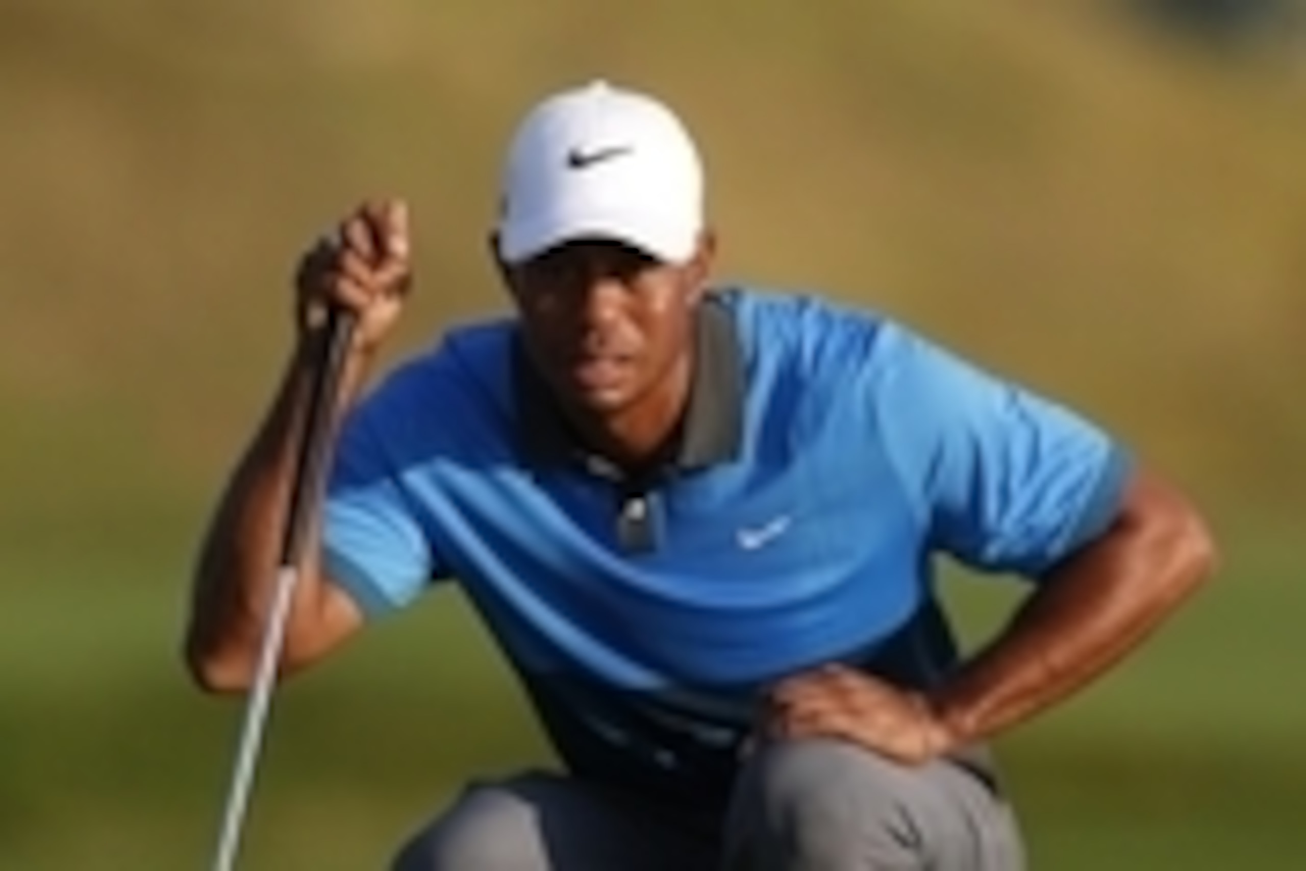 Aug 15, 2015; Sheboygan, WI, USA; Tiger Woods lines up a putt on the 15th green during the continuation of the second round of the 2015 PGA Championship golf tournament at Whistling Straits. Mandatory Credit: Brian Spurlock-USA TODAY Sports