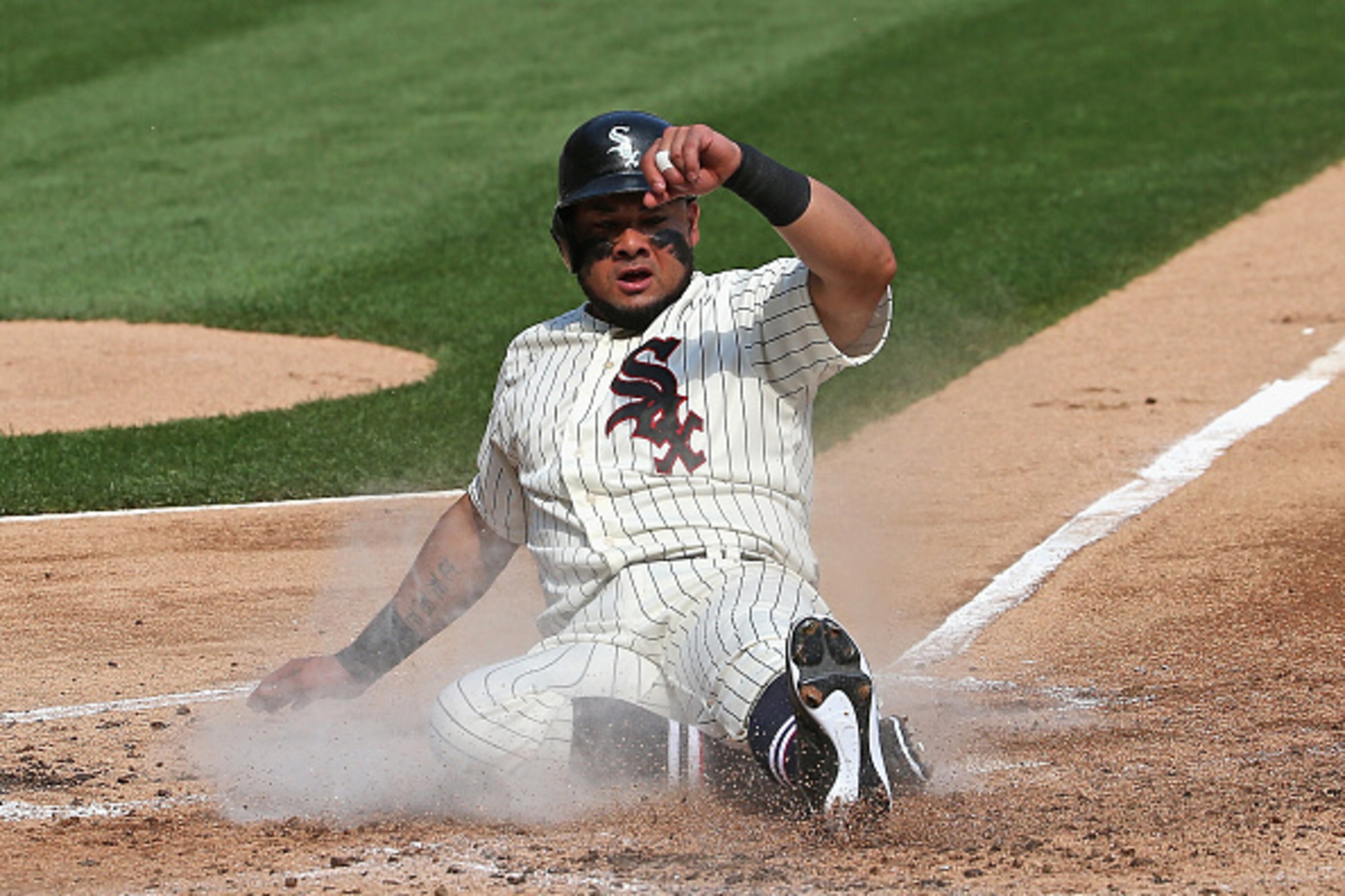 CHICAGO, IL - AUGUST 14: Melky Cabrera #53 of the Chicago White Sox slides across the plate to score a run in the 1st inning against the Chicago Cubs at U.S. Cellular Field on August 14, 2015 in Chicago, Illinois. (Photo by Jonathan Daniel/Getty Images)