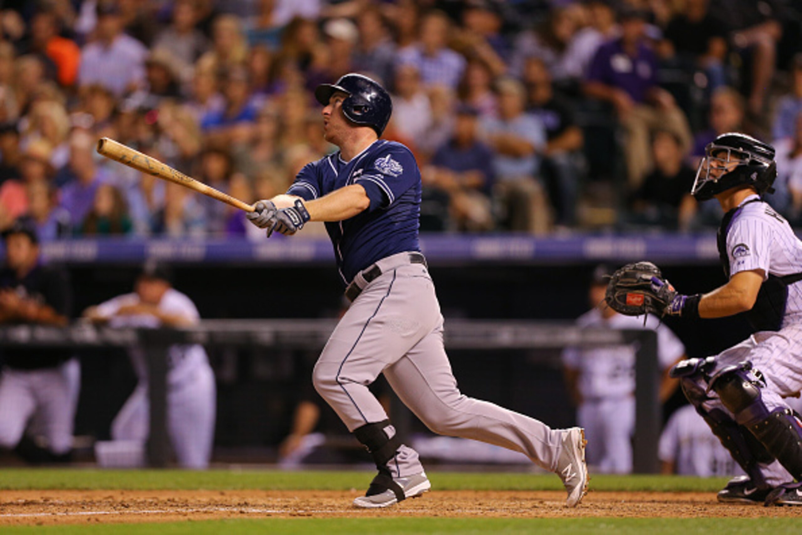 DENVER, CO - AUGUST 14: Jedd Gyorko #9 of the San Diego Padres watches his three run home run during the seventh inning against the Colorado Rockies at Coors Field on August 14, 2015 in Denver, Colorado. The Padres defeated the Rockies 9-5. (Photo by Just