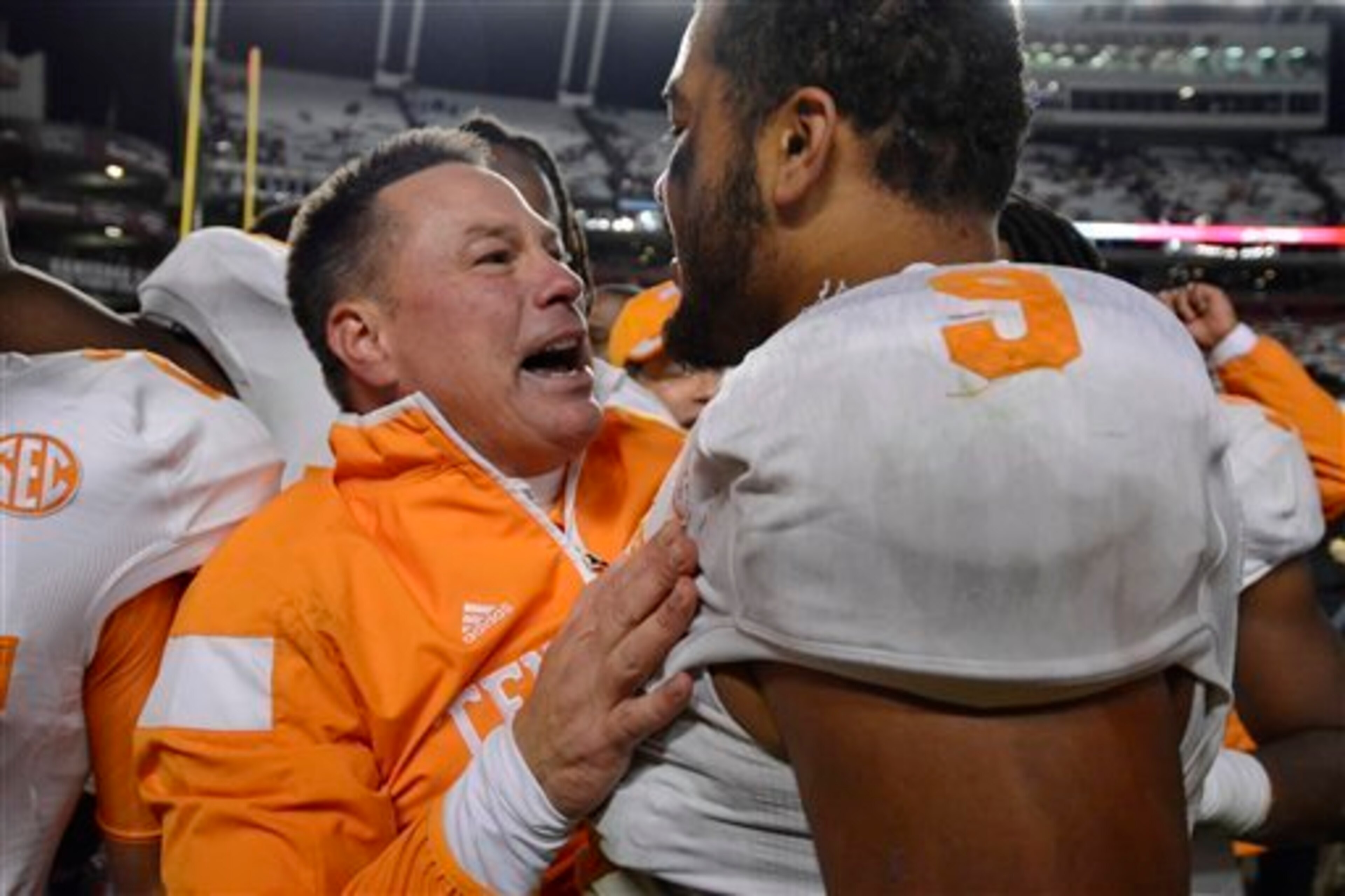 Tennessee head coach Butch Jones (left) and DE Derek Barnett