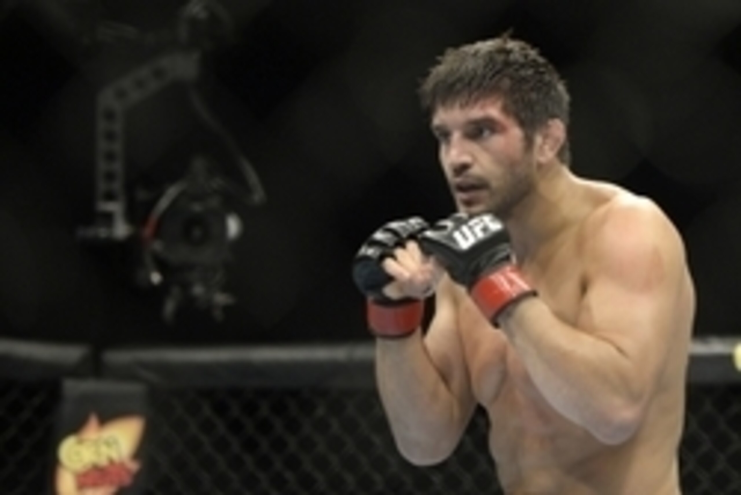 Apr 16, 2014; Quebec City, Quebec, Canada; Patrick Cote (red gloves) fights against Kyle Noke (not pictured) during their welterweight bout at Colisee Pepsi. Mandatory Credit: Eric Bolte-USA TODAY Sports