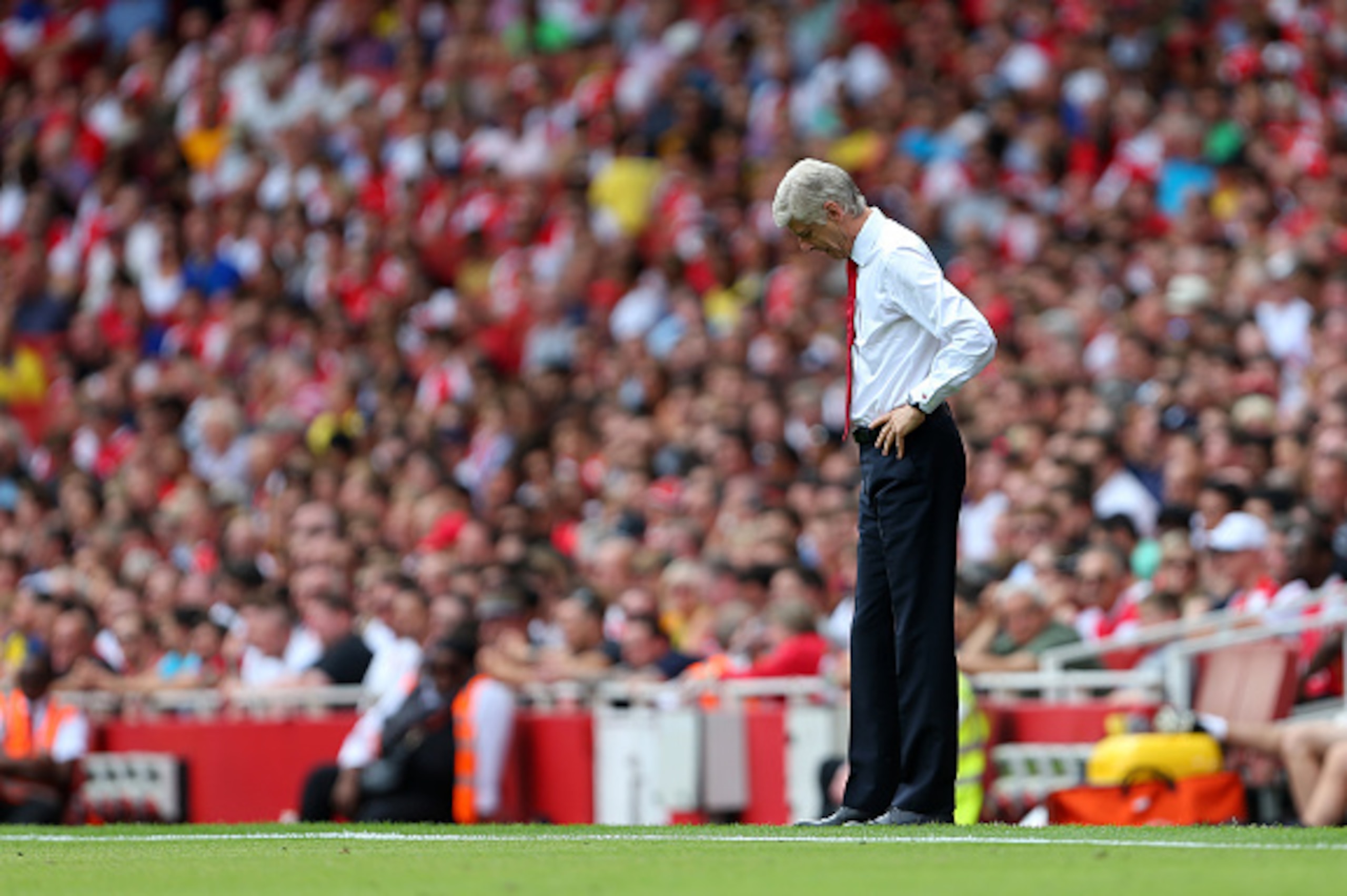 LONDON, ENGLAND - AUGUST 09: A dejected looking Arsene Wenger manager of Arsenal during the Barclays Premier League match between Arsenal and West Ham United at Emirates Stadium on August 9, 2015 in London, England. (Photo by Catherine Ivill - AMA/Getty LONDON, ENGLAND - AUGUST 09: A dejected looking Arsene Wenger manager of Arsenal during the Barclays Premier League match between Arsenal and West Ham United at Emirates Stadium on August 9, 2015 in London, England. (Photo by Catherine Ivill - AMA/Getty