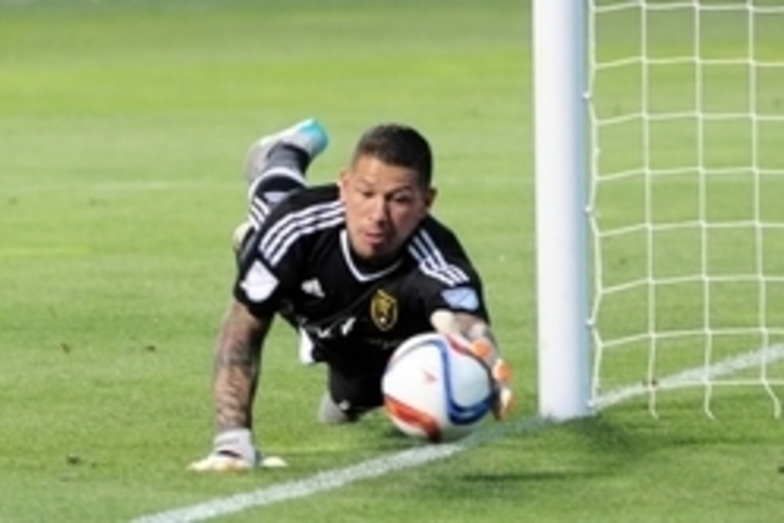 Aug 15, 2015; Sandy, UT, USA; Real Salt Lake goalkeeper Nick Rimando (18) smothers a ball against the Portland Timbers during the first half at Rio Tinto Stadium. Mandatory Credit: Joe Camporeale-USA TODAY Sports