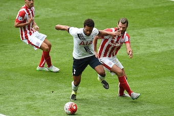 LONDON, ENGLAND - AUGUST 15:  Mousa Dembele of Tottenham Hotspur and Erik Pieters of Stoke City in action during the Barclays Premier League match between Tottenham Hotspur and Stoke City at White Hart Lane on August 15, 2015 in London, United Kingdom.  (
