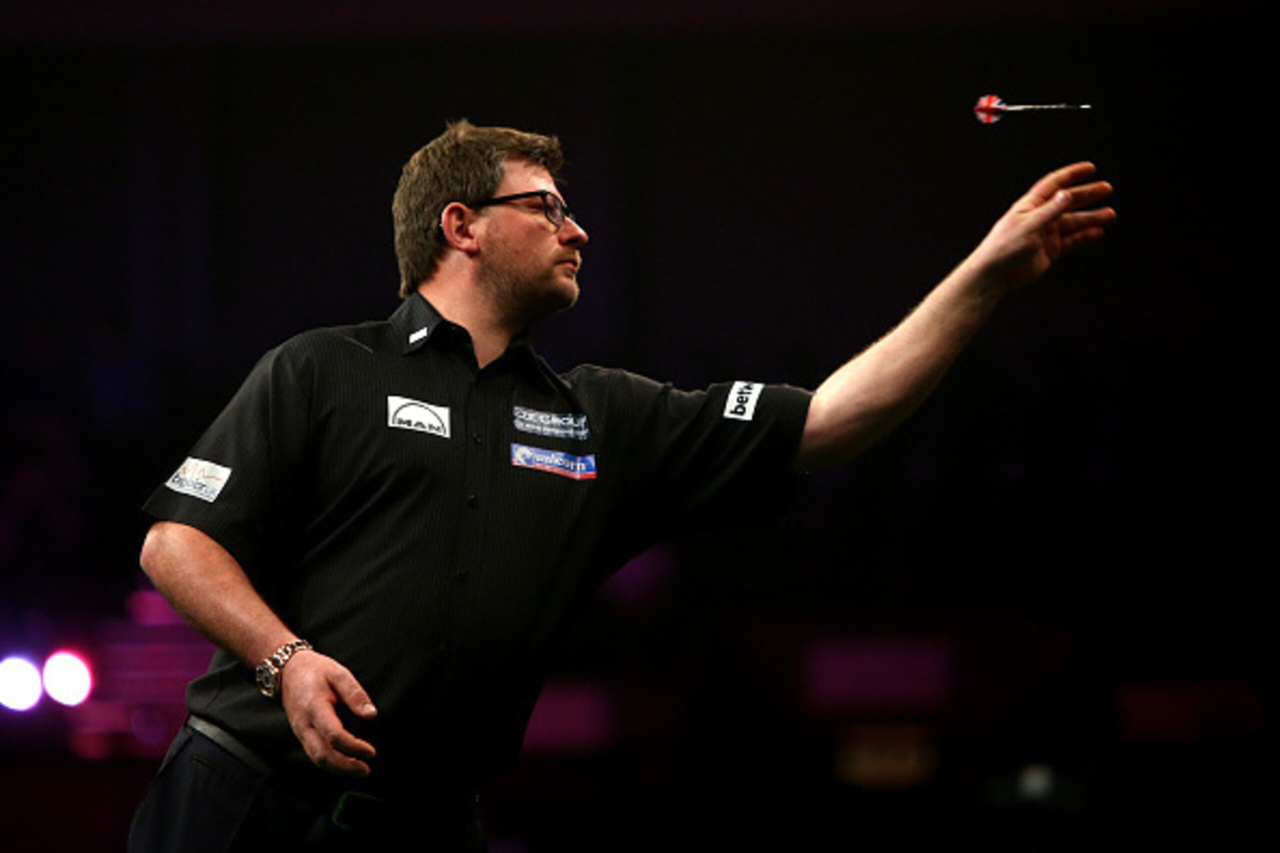 BRIGHTON, ENGLAND - MAY 14: James Wade of England in action during his match against Phil Taylor of England during the Betway Premier League at The Brighton Centre on May 14, 2015 in Brighton, England. (Photo by Charlie Crowhurst/Getty Images)