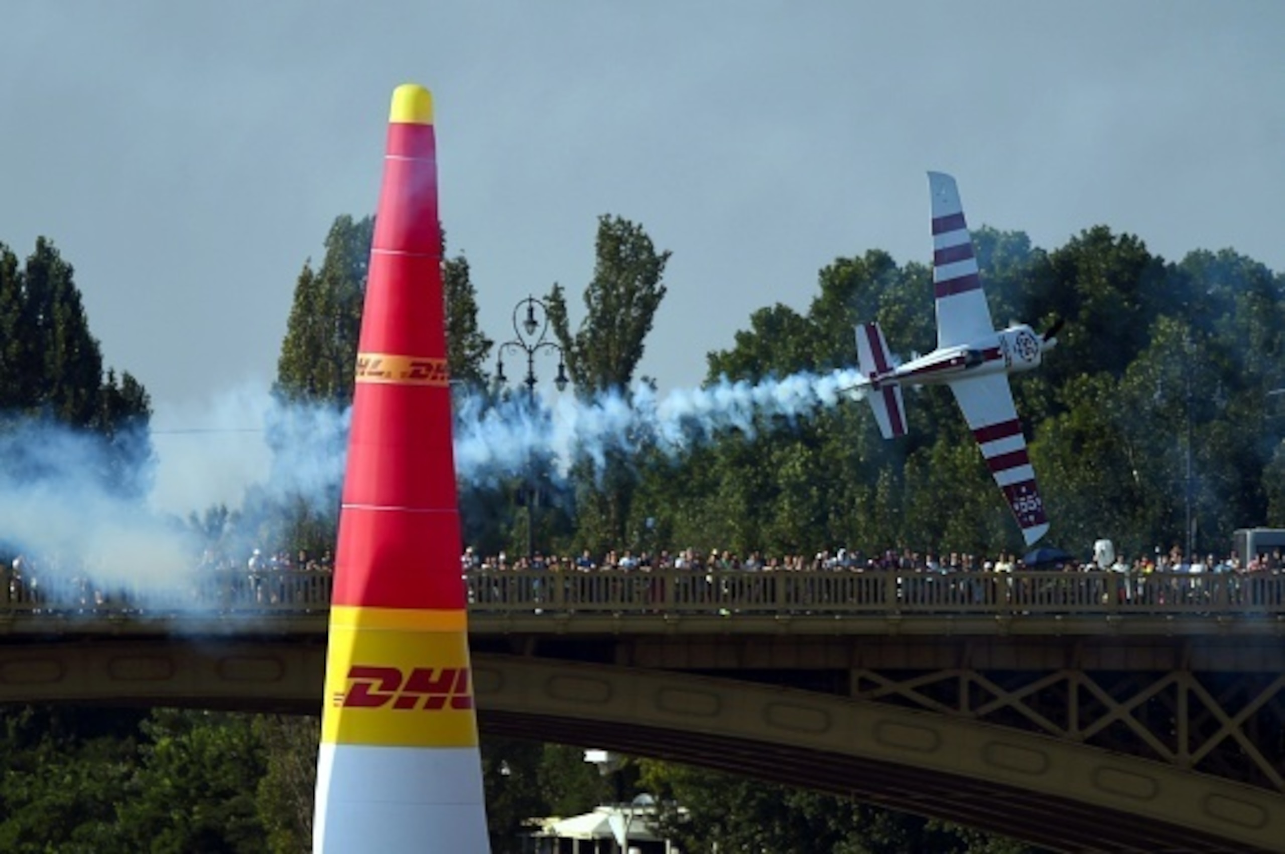 British Paul Bonhomme with his EDGE540 V3 type plane flies over the Danube River at the Margaret Bridge during the 2015 Red Bull Air Race World Championship in Budapest on July 5, 2015. AFP PHOTO / ATTILA KISBENEDEK (Photo credit should read ATTIL British Paul Bonhomme with his EDGE540 V3 type plane flies over the Danube River at the Margaret Bridge during the 2015 Red Bull Air Race World Championship in Budapest on July 5, 2015. AFP PHOTO / ATTILA KISBENEDEK (Photo credit should read ATTIL
