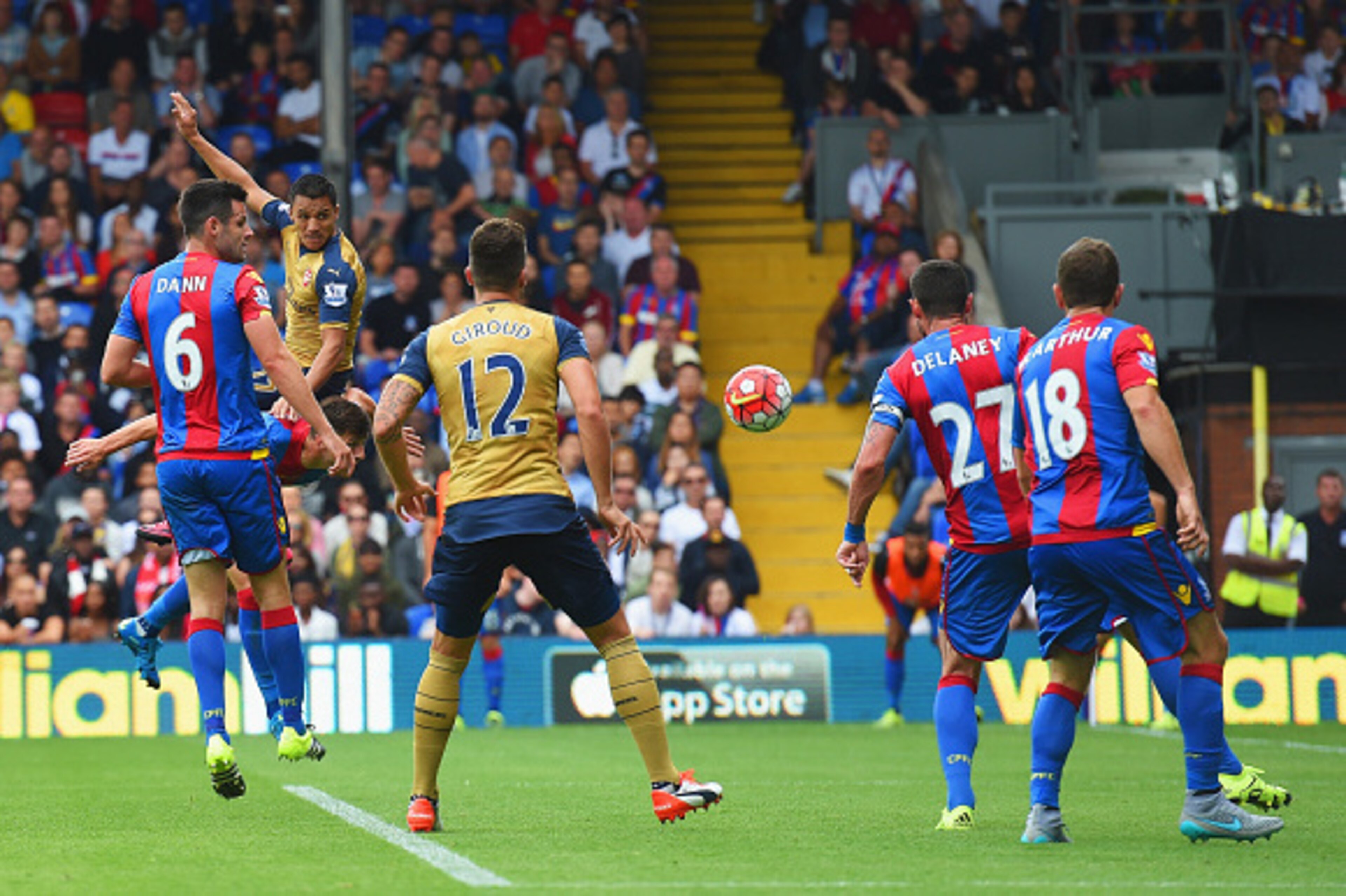 LONDON, ENGLAND - AUGUST 16:  Alexis Sanchez of Arsenal wins a header leading to the own goal scored by Damien Delaney of Crystal Palace during the Barclays Premier League match between Crystal Palace and Arsenal at Selhurst Park on August 16, 2015 in Lon