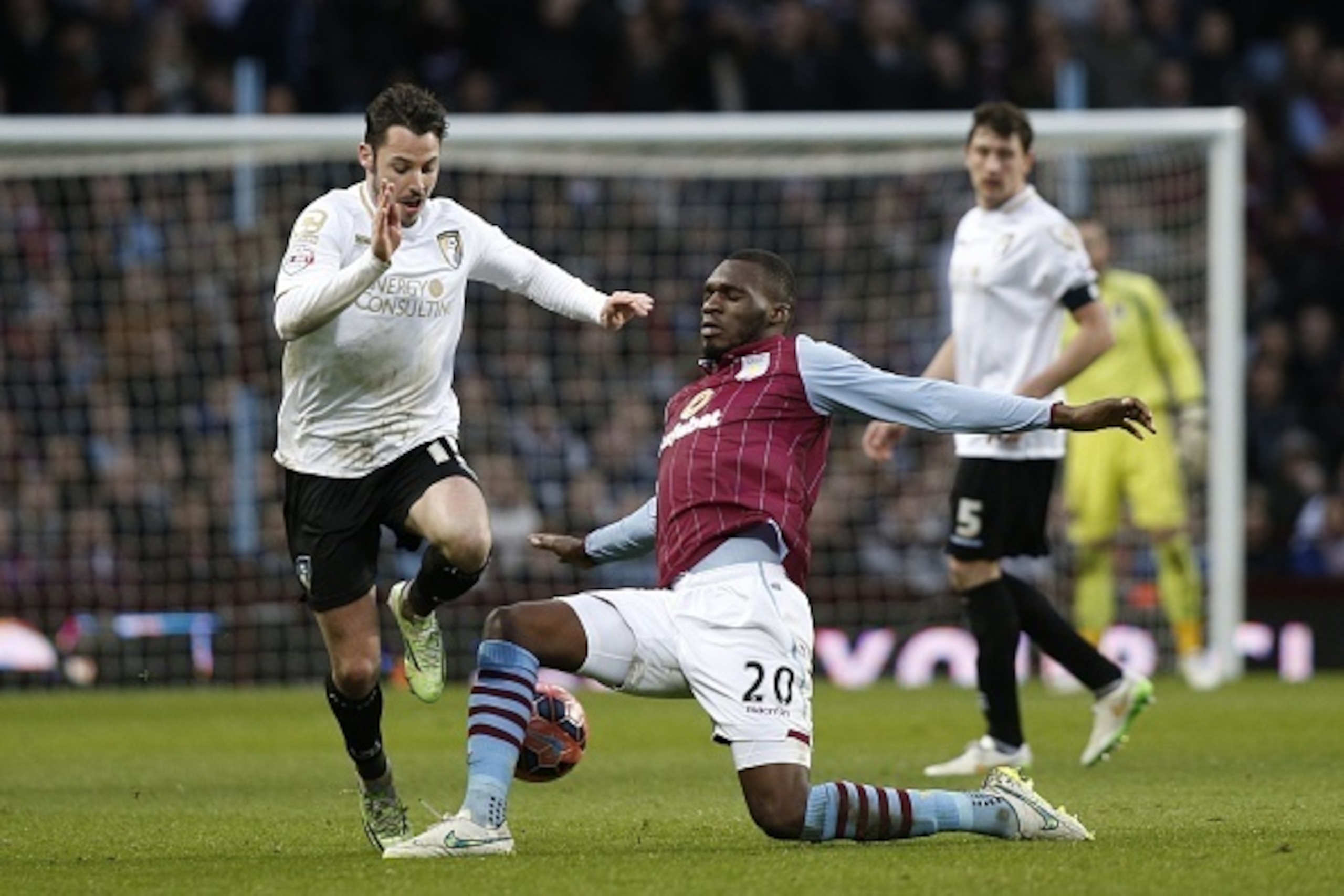 Bournemouth's English defender Adam Smith (L) vies with Aston Villa's Zaire-born Belgian striker Christian Benteke during the FA Cup fourth round football match between Aston Villa and Bournemouth at Villa Park in Birmingham, central England on January 25