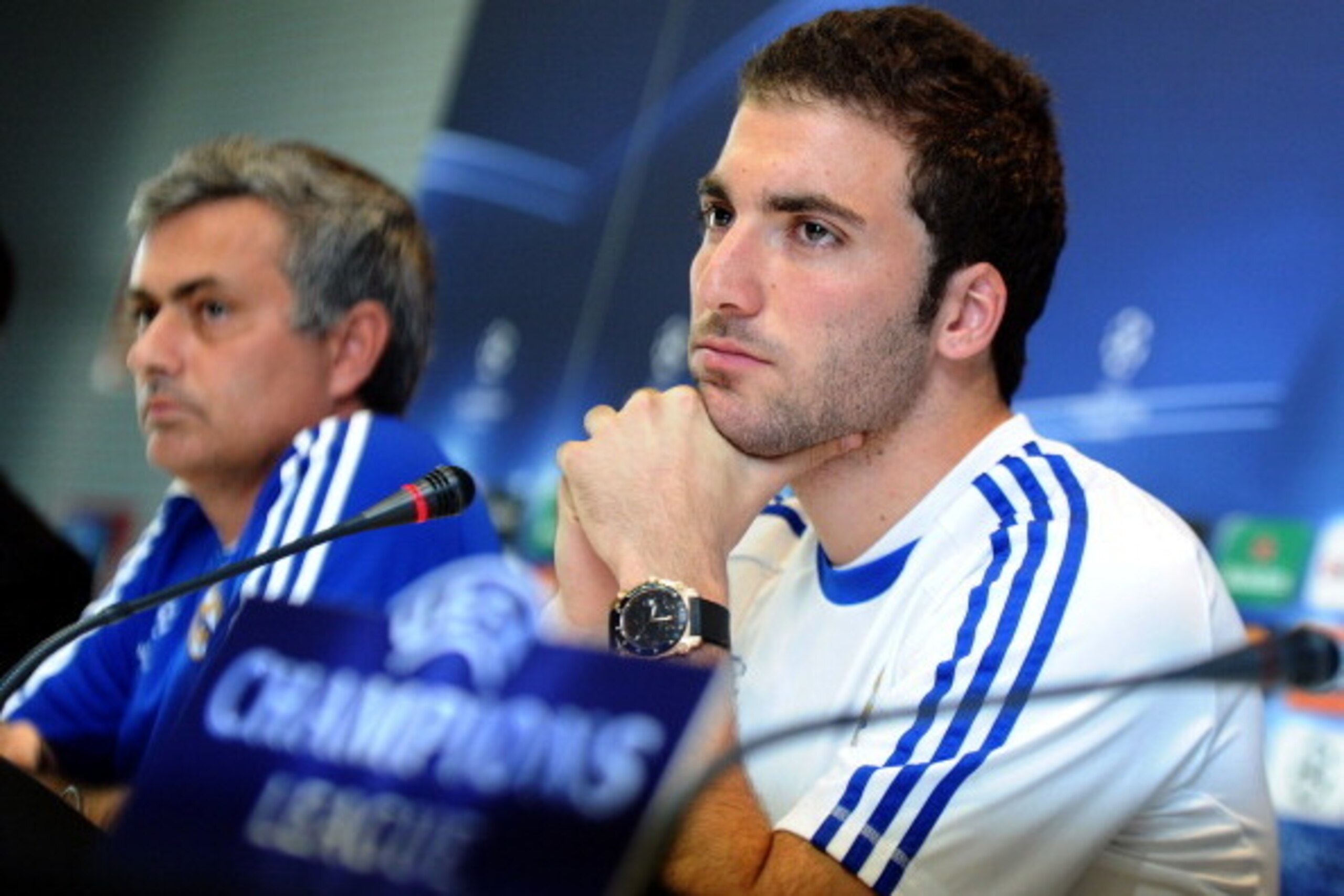 Real Madrid's Argentinian forward Gonzalo Higuain (R) gives a press conference with Real Madrid's Portuguese coach Jose Mourinho (L) in Madrid on April 4, 2011, on the eve of their Champions League quarter-final first leg match against Tottenham Hotspur. 
