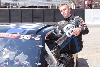 SMITHTON, PA - AUGUST 15: Dalton Sargeant, driver of the #51 GALT Chevrolet, exits his car and finishes with the fastest practice time for the NASCAR K&N Pro Series East race on August 15, 2015 at the Motordrome Speedway in Smithton, Pennsylvania.  (Photo