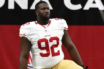 GLENDALE, AZ - SEPTEMBER 21:  Defensive tackle Quinton Dial #92 of the San Francisco 49ers stretches prior to the start of the NFL game against the Arizona Cardinals at University of Phoenix Stadium on September 21, 2014 in Glendale, Arizona.  (Photo by N