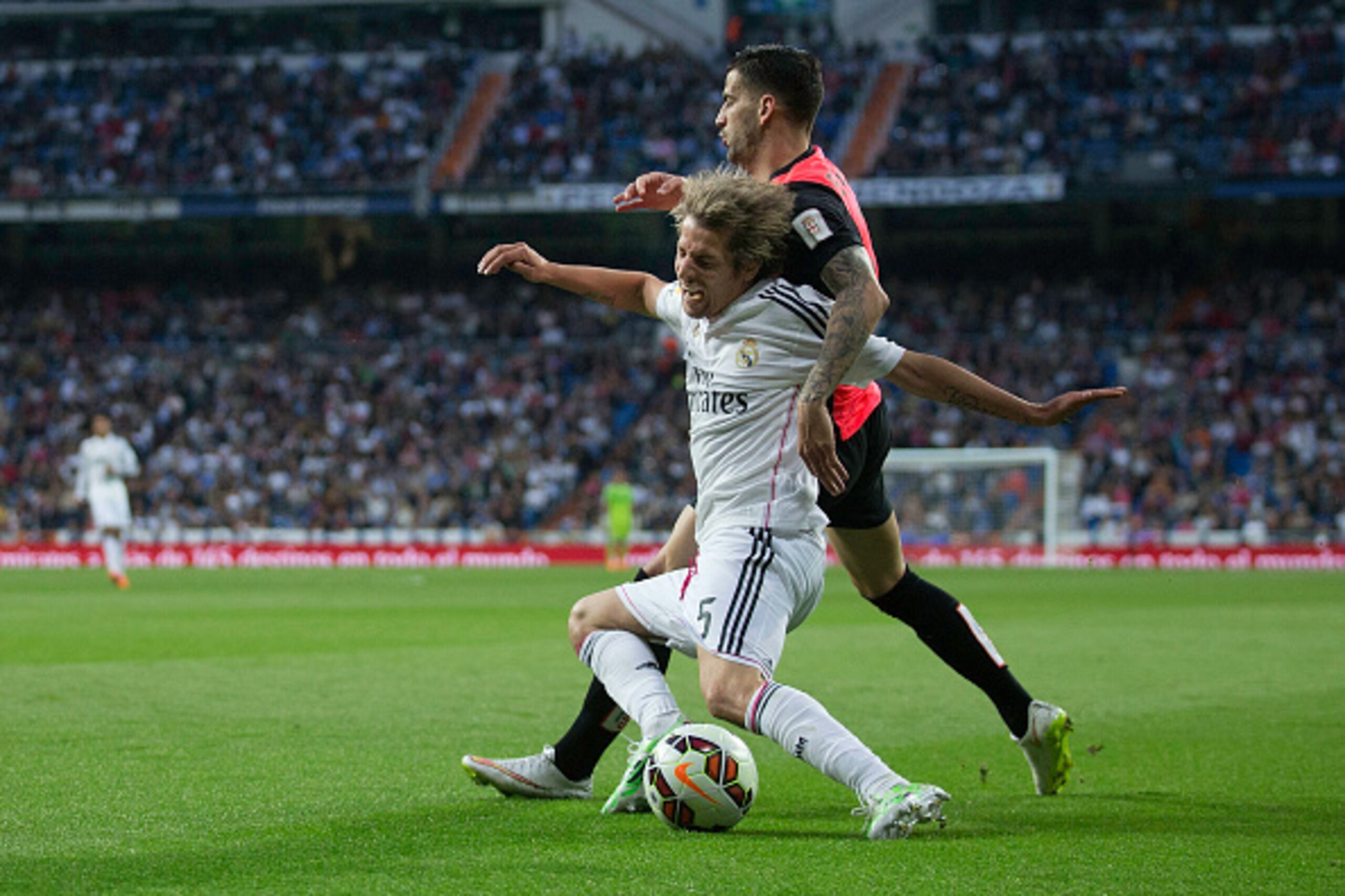 MADRID, SPAIN - APRIL 29: Edgar Antonio Mendez Ortega (R) of Almeria UD tackles Fabio Coentrao (L) of Real Madrid CF during the La Liga match between Real Madrid CF and UD Almeria at Estadio Santiago Bernabeu on April 29, 2015 in Madrid, Spain. (Photo by MADRID, SPAIN - APRIL 29: Edgar Antonio Mendez Ortega (R) of Almeria UD tackles Fabio Coentrao (L) of Real Madrid CF during the La Liga match between Real Madrid CF and UD Almeria at Estadio Santiago Bernabeu on April 29, 2015 in Madrid, Spain. (Photo by