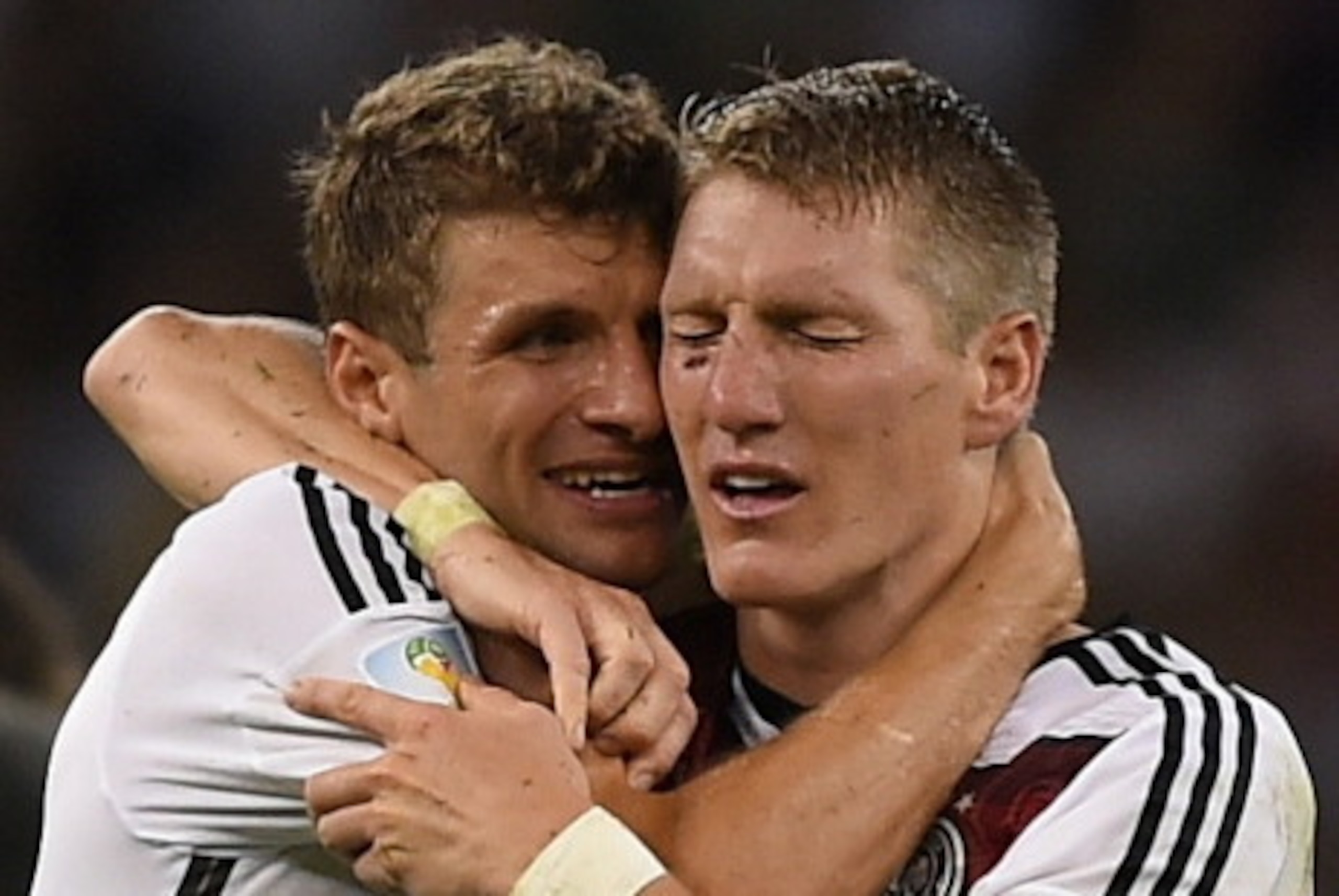 Germany's forward Thomas Mueller (L) and Germany's midfielder Bastian Schweinsteiger celebrate after winning the 2014 FIFA World Cup final football match between Germany and Argentina 1-0 following extra-time at the Maracana Stadium in Rio de Janeiro, Bra