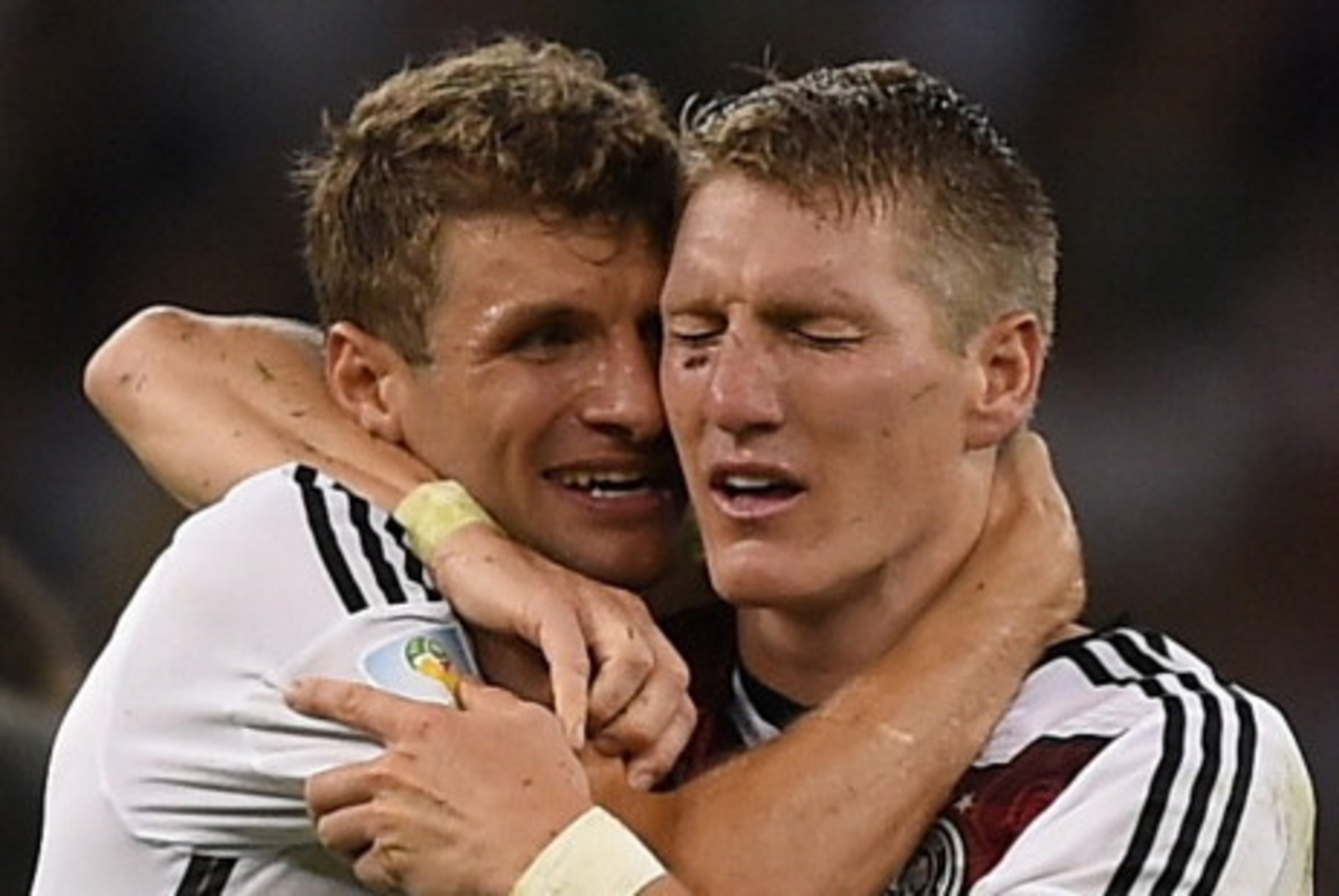Germany's forward Thomas Mueller (L) and Germany's midfielder Bastian Schweinsteiger celebrate after winning the 2014 FIFA World Cup final football match between Germany and Argentina 1-0 following extra-time at the Maracana Stadium in Rio de Janeiro, Bra