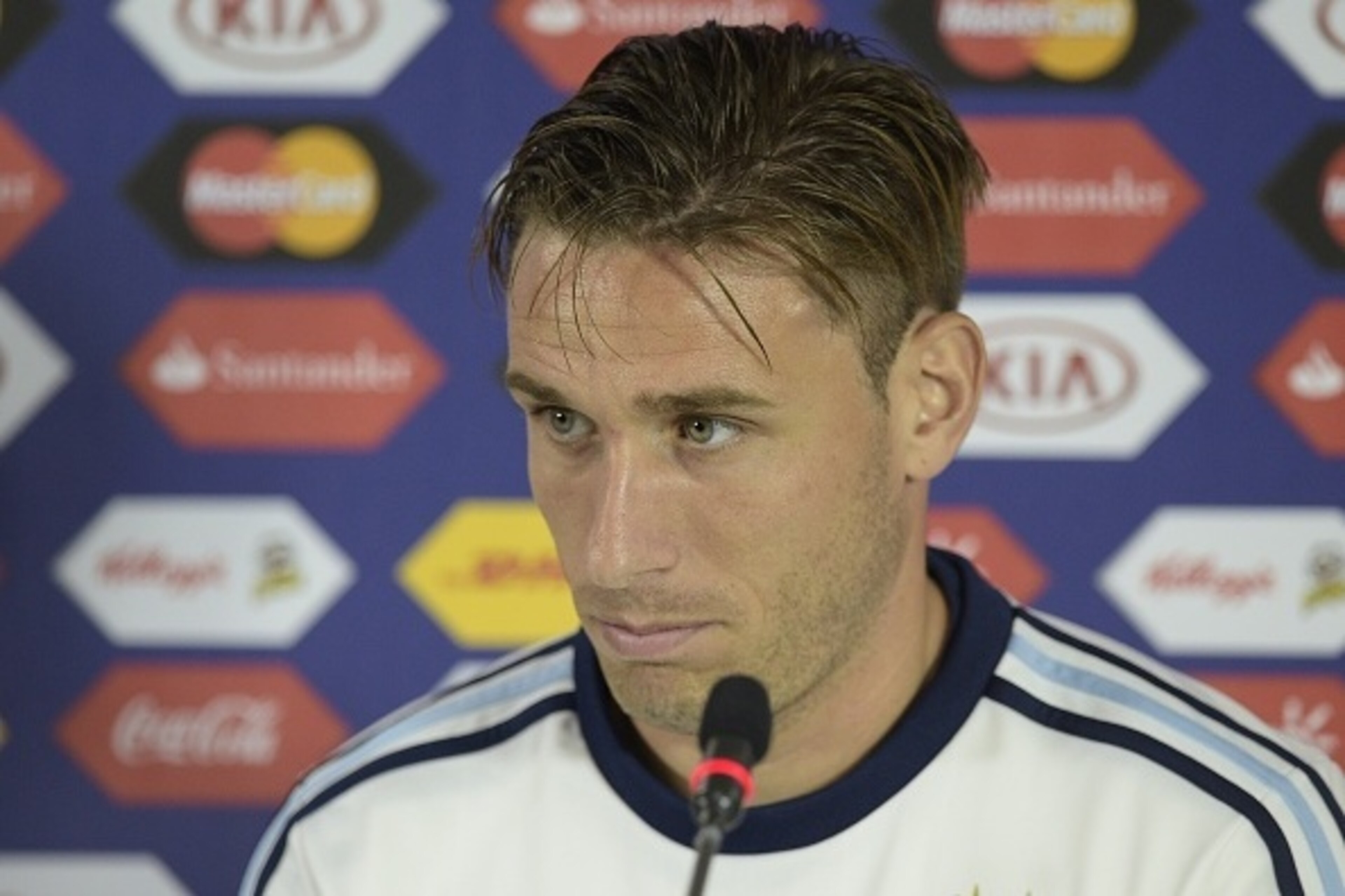 Argentina's midfielder Lucas Biglia listens  during a press conference at Alcaldesa Ester Roa Rebolledo stadium in Concepcion, Chile on June 29, 2015, on the eve of the Copa America Chile 2015 semifinal football match against Paraguay. AFP PHOTO / JUAN MA