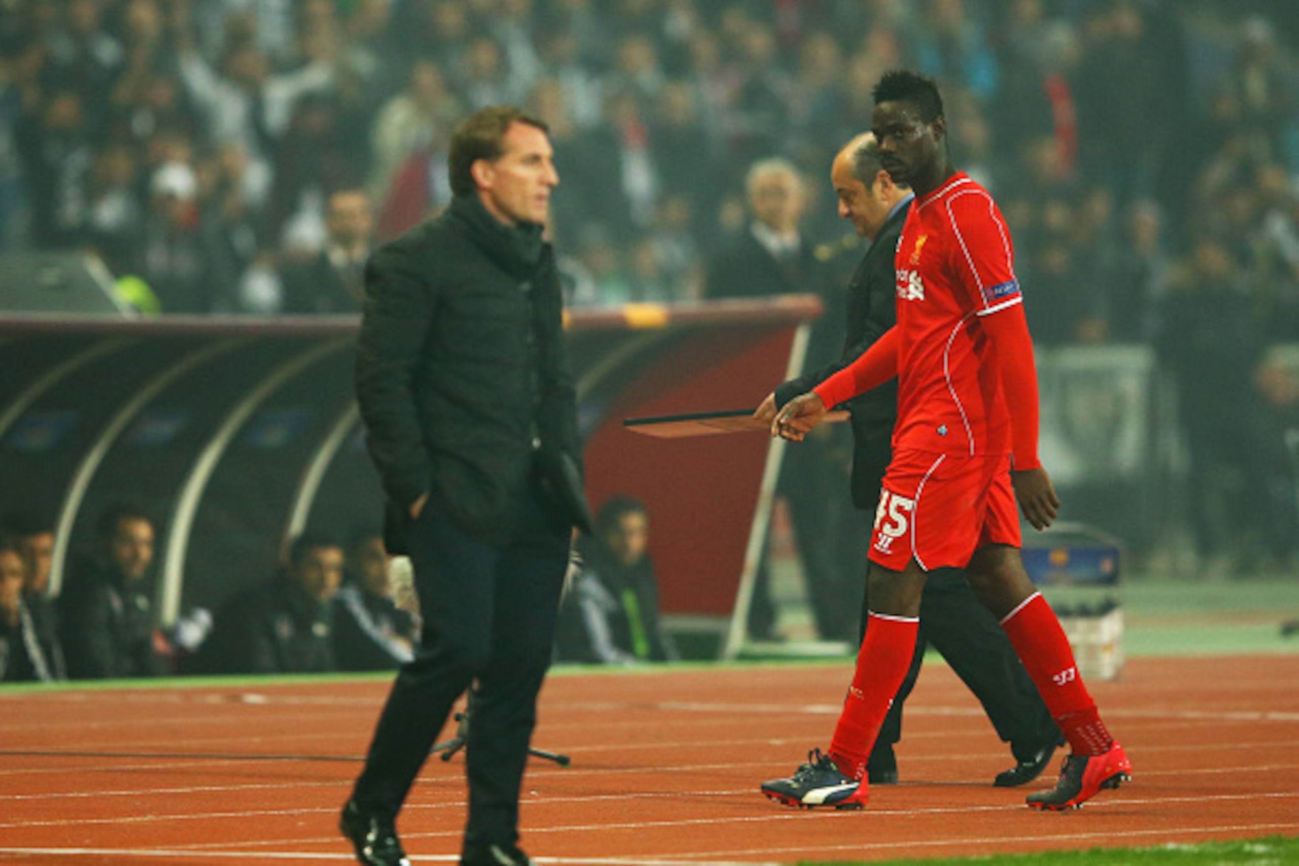 ISTANBUL, TURKEY - FEBRUARY 26:  Mario Balotelli of Liverpool looks across as Brendan Rodgers manager of Liverpool as he is substituted during the UEFA Europa League Round of 32 second leg match between Besiktas JK and Liverpool FC on February 26, 2015 in