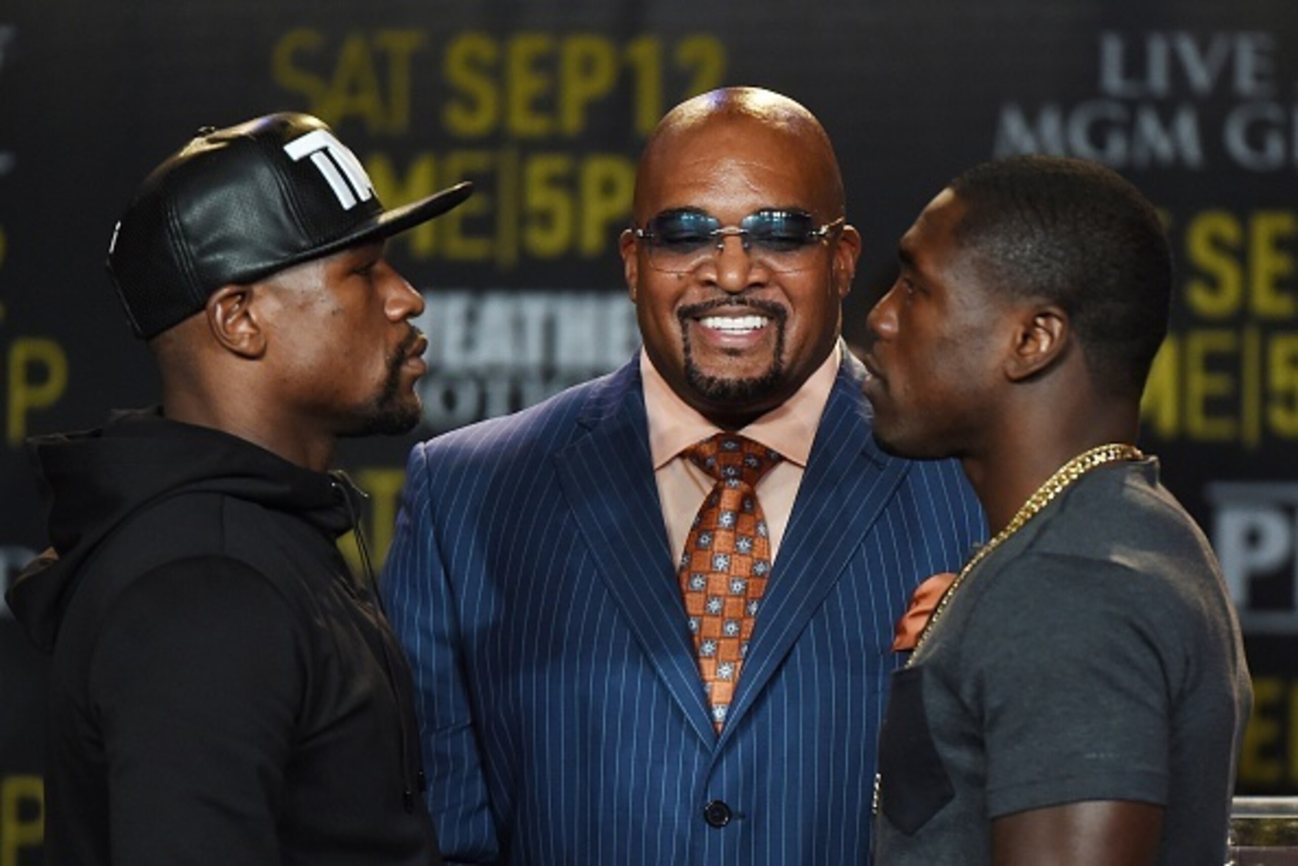 Boxers Floyd 'Money' Mayweather (L) and Andre Berto (R) face off during a press conference to officially announce their September 12 fight that will place at the MGM Grand Garden Arena in Las Vegas, at the Marriott Hotel in Los Angeles, California on Augu