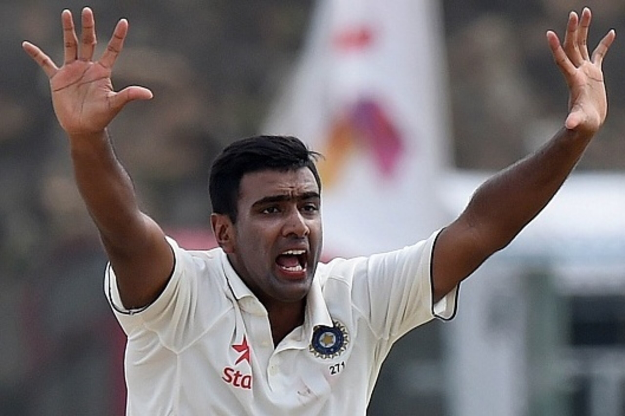 Indian cricketer Ravichandran Ashwin celebrates after dismissing Sri Lankan cricketer Dhammika Prasad during the first day of the opening Test cricket match between Sri Lanka and India at The Galle International Cricket Stadium in Galle on August 12, 2015