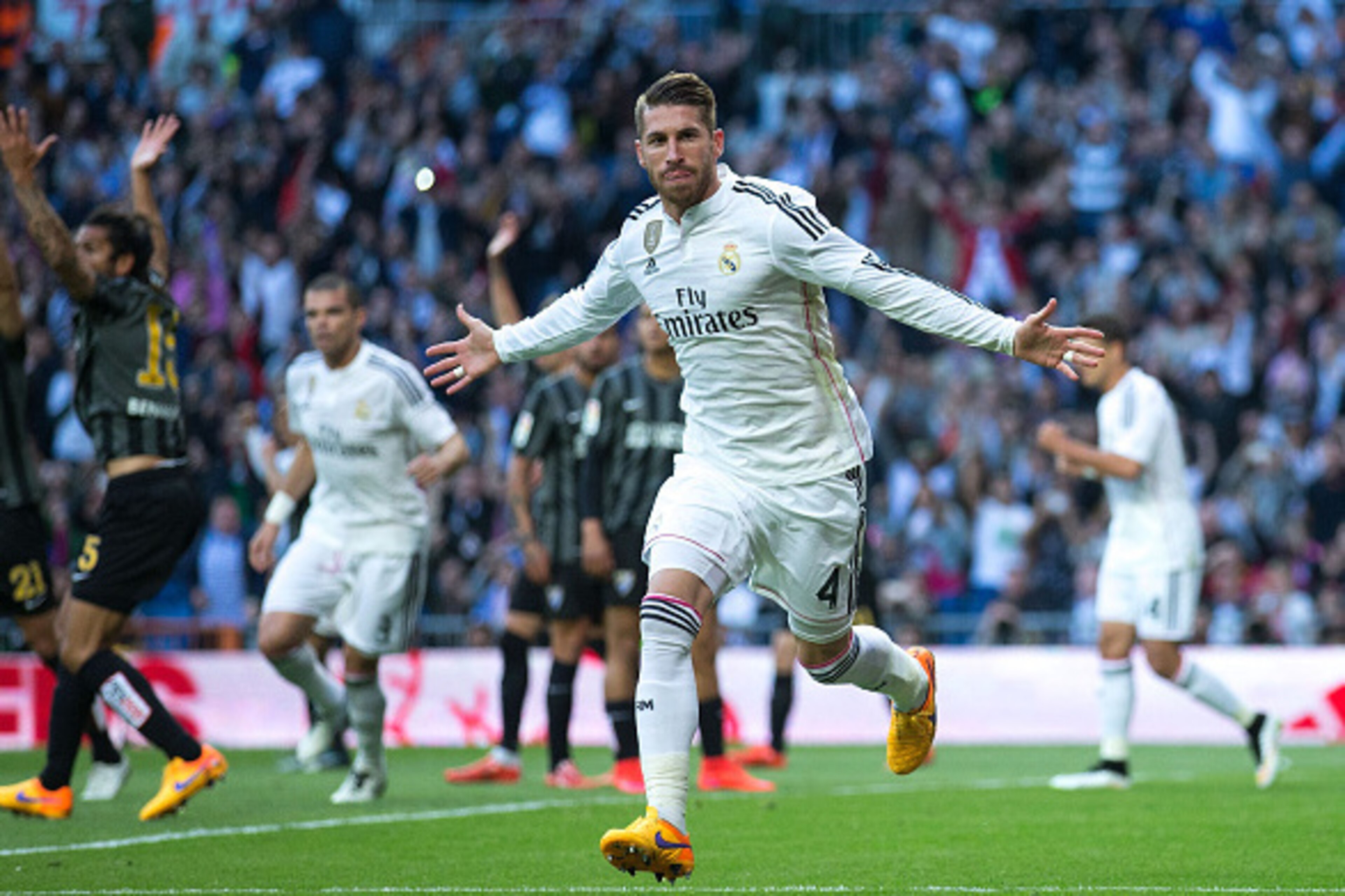 MADRID, SPAIN - APRIL 18: Sergio Ramos of Real Madrid CF celebrates scoring their opening goal during the La Liga match between Real Madrid CF and Malaga CF at Estadio Santiago Bernabeu on April 18, 2015 in Madrid, Spain. (Photo by Gonzalo Arroyo Moreno/ MADRID, SPAIN - APRIL 18: Sergio Ramos of Real Madrid CF celebrates scoring their opening goal during the La Liga match between Real Madrid CF and Malaga CF at Estadio Santiago Bernabeu on April 18, 2015 in Madrid, Spain. (Photo by Gonzalo Arroyo Moreno/